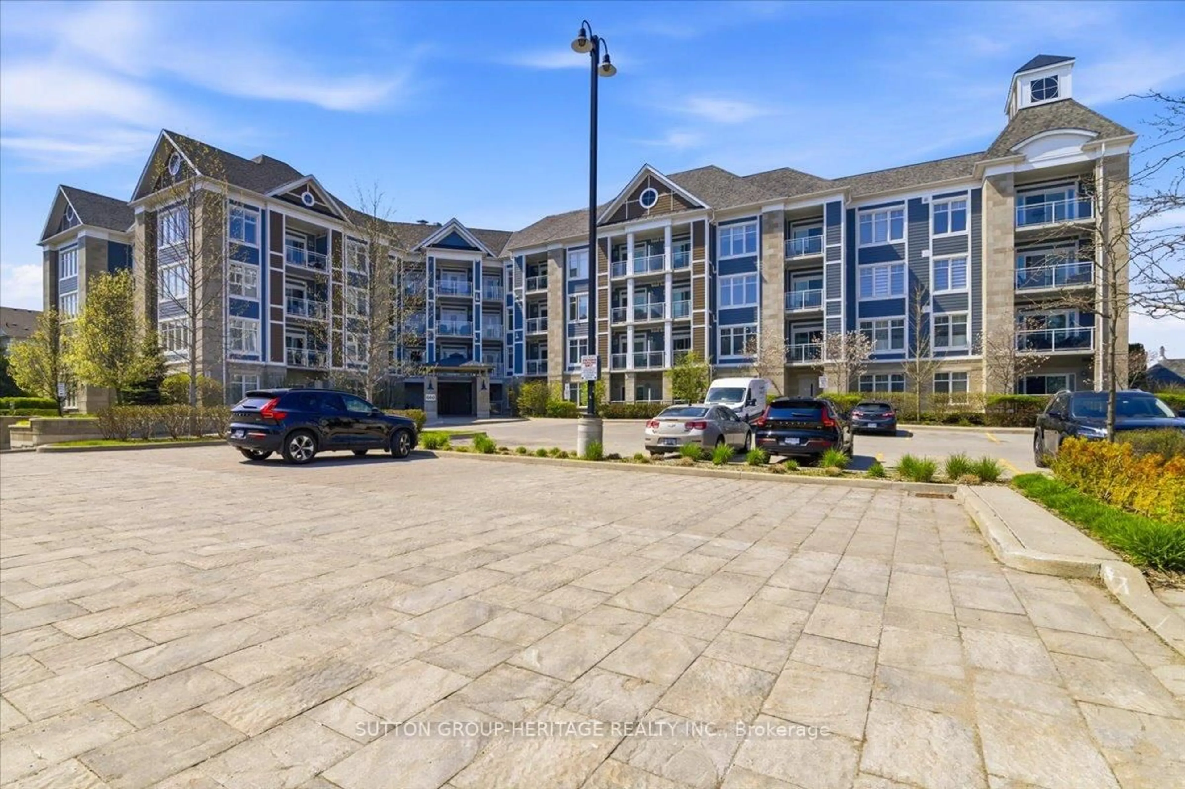 A pic from outside/outdoor area/front of a property/back of a property/a pic from drone, unknown for 660 Gordon St #201, Whitby Ontario L1N 0L1