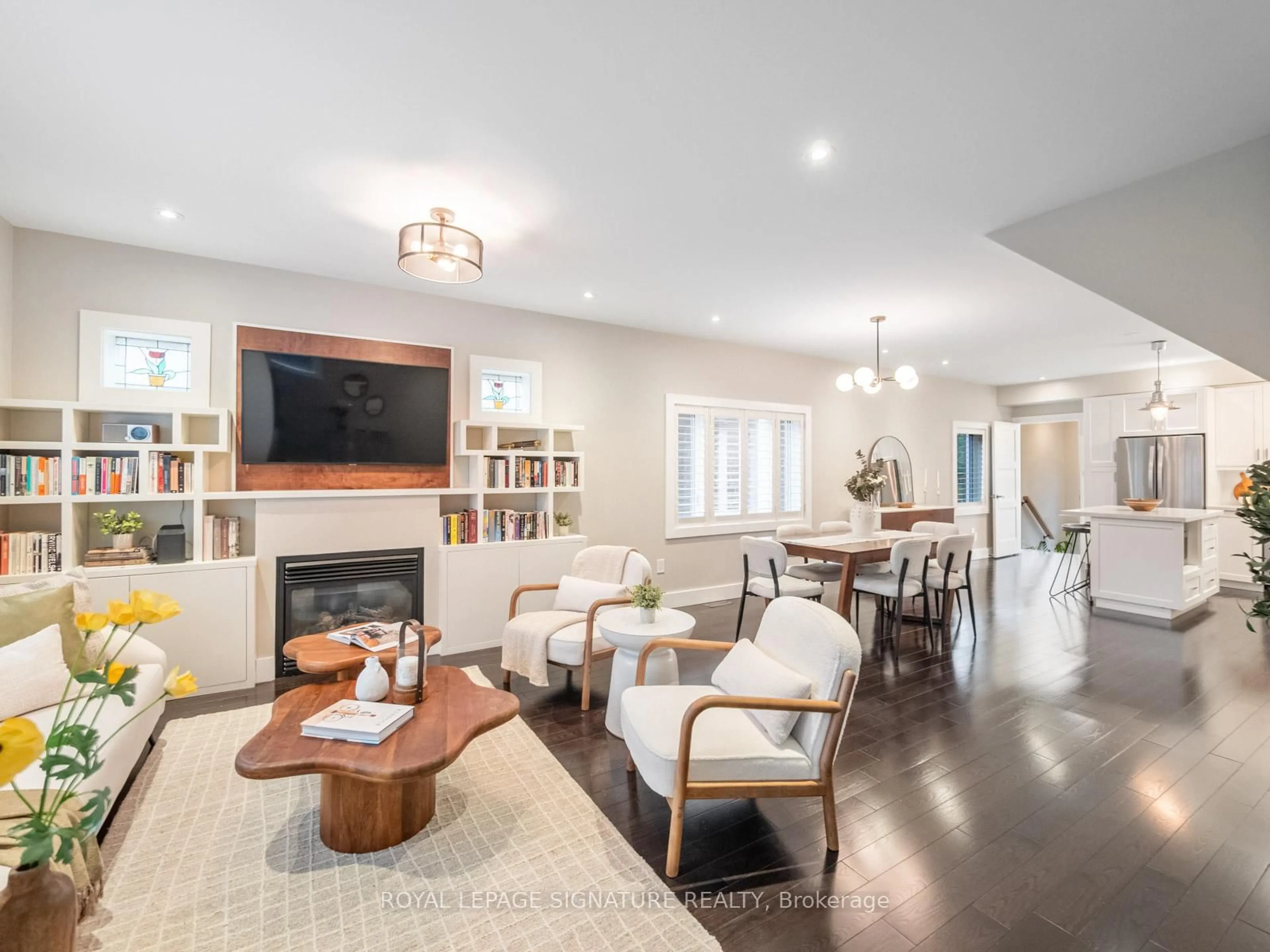 Living room with furniture, wood/laminate floor for 995 Greenwood Ave, Toronto Ontario M4J 4C7