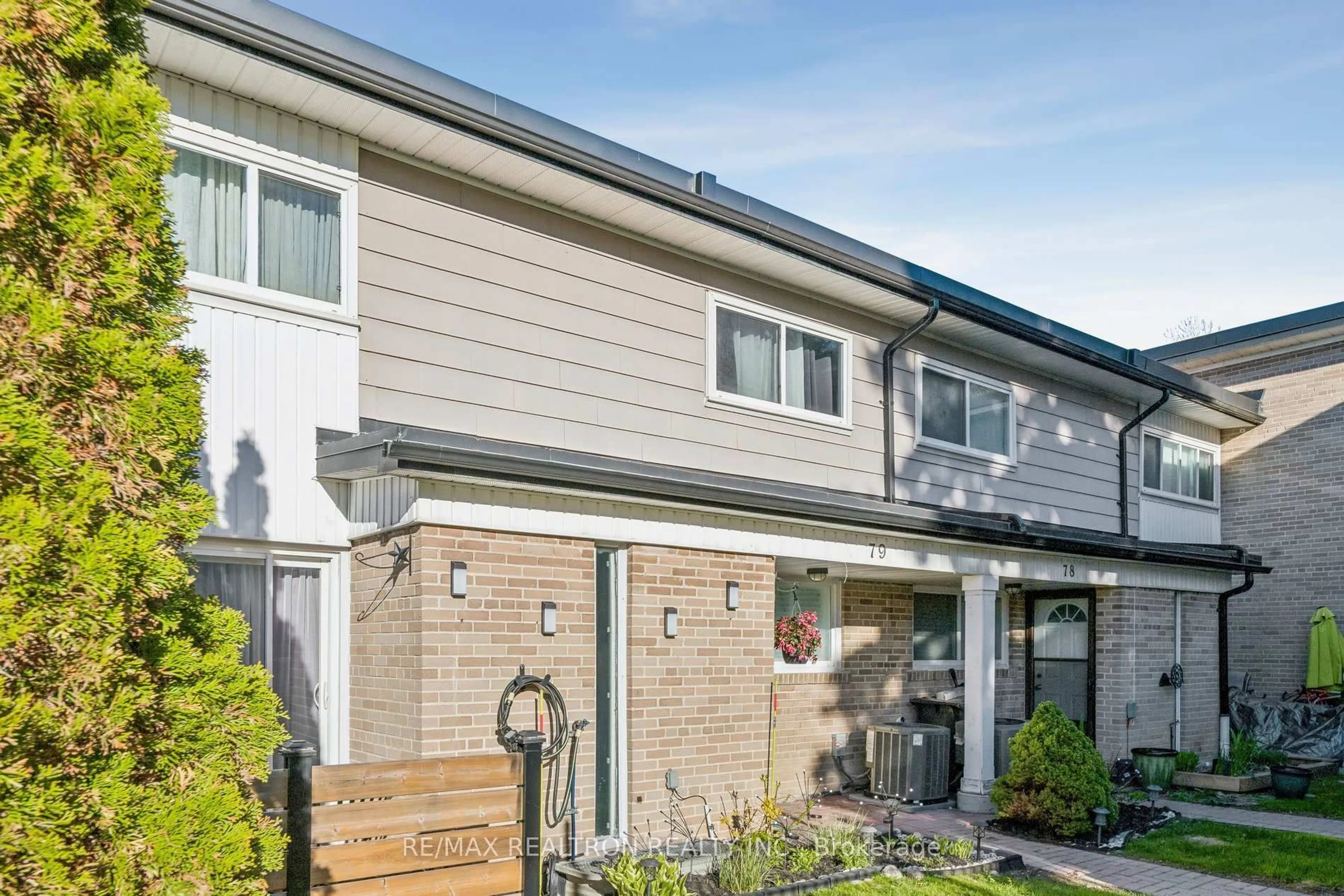 Home with brick exterior material, street for 925 Bayly St #79, Pickering Ontario L1W 1L7
