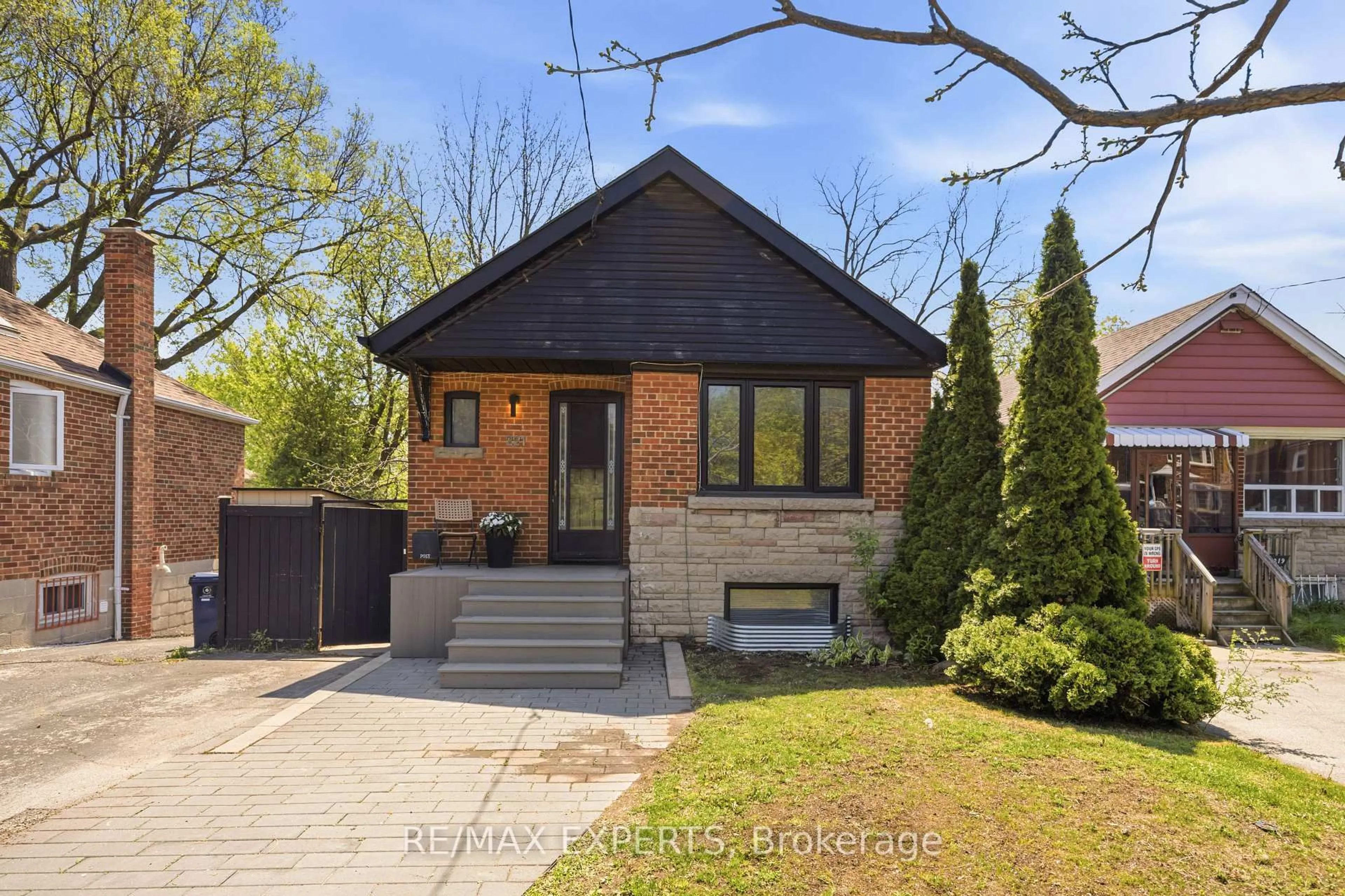 Home with brick exterior material, street for 221 Clonmore Dr, Toronto Ontario M1N 1Y4