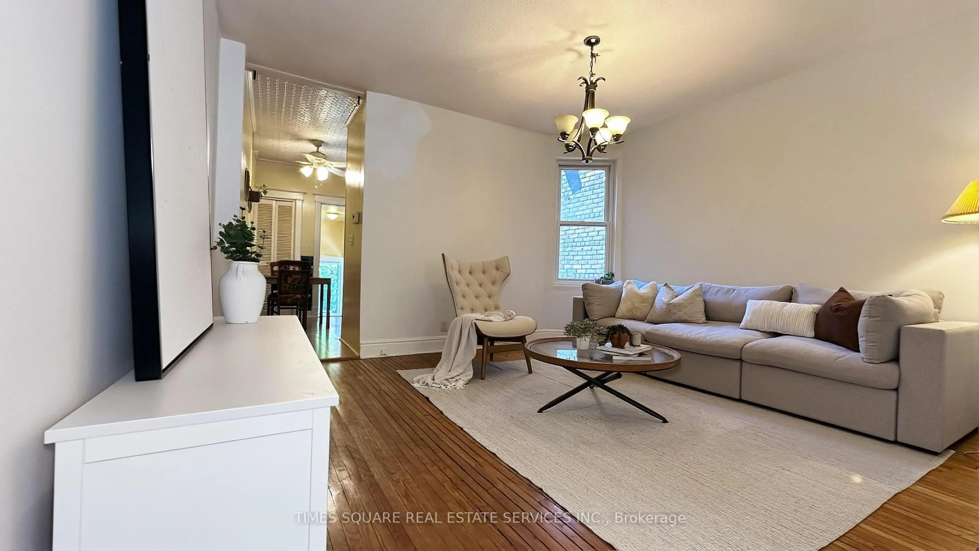 Living room with furniture, wood/laminate floor for 7 Badgerow Ave, Toronto Ontario M4M 1T9