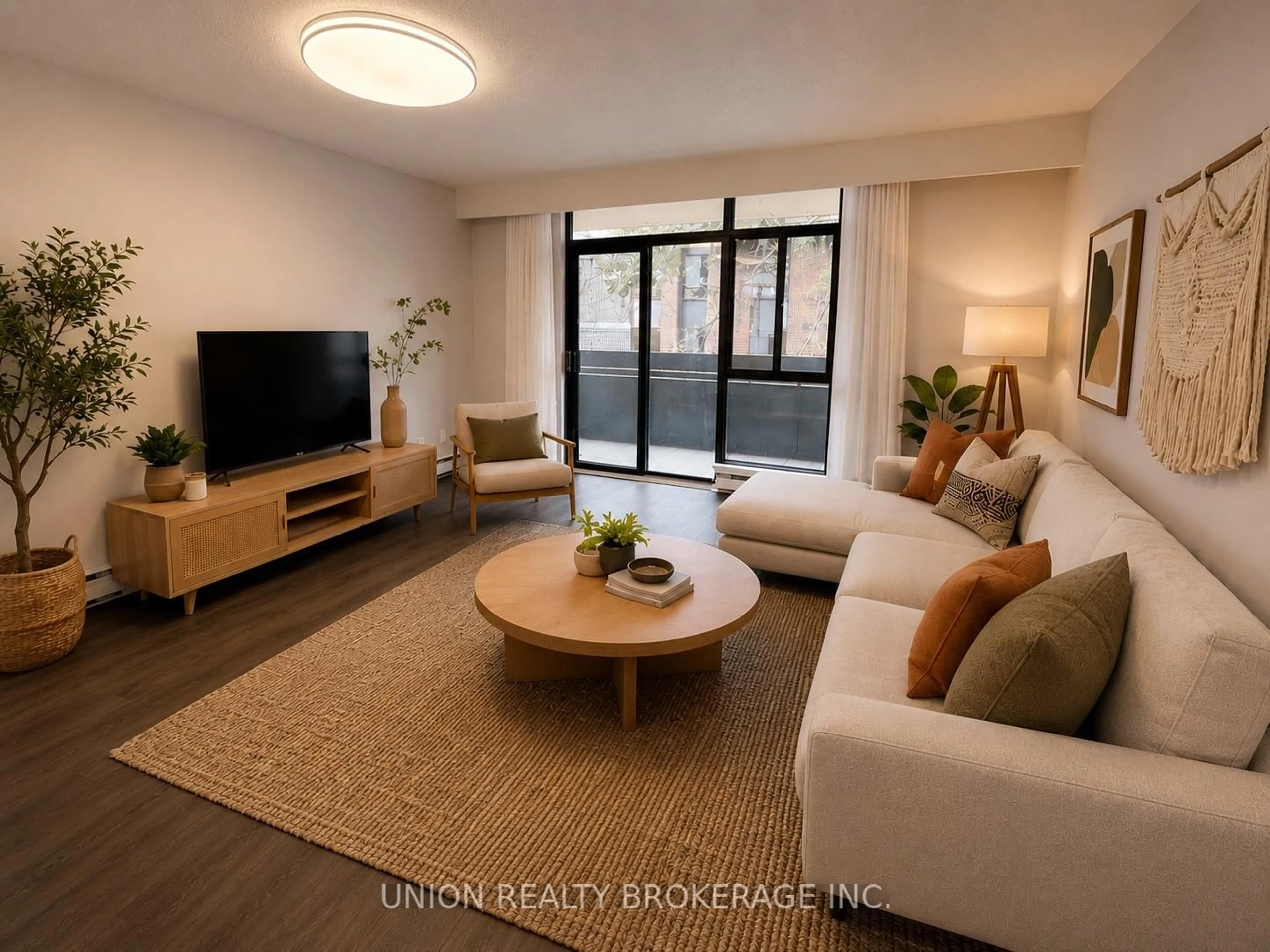 Living room with furniture, wood/laminate floor for 50 Old Kingston Rd #1-304, Toronto Ontario M1E 4Y1