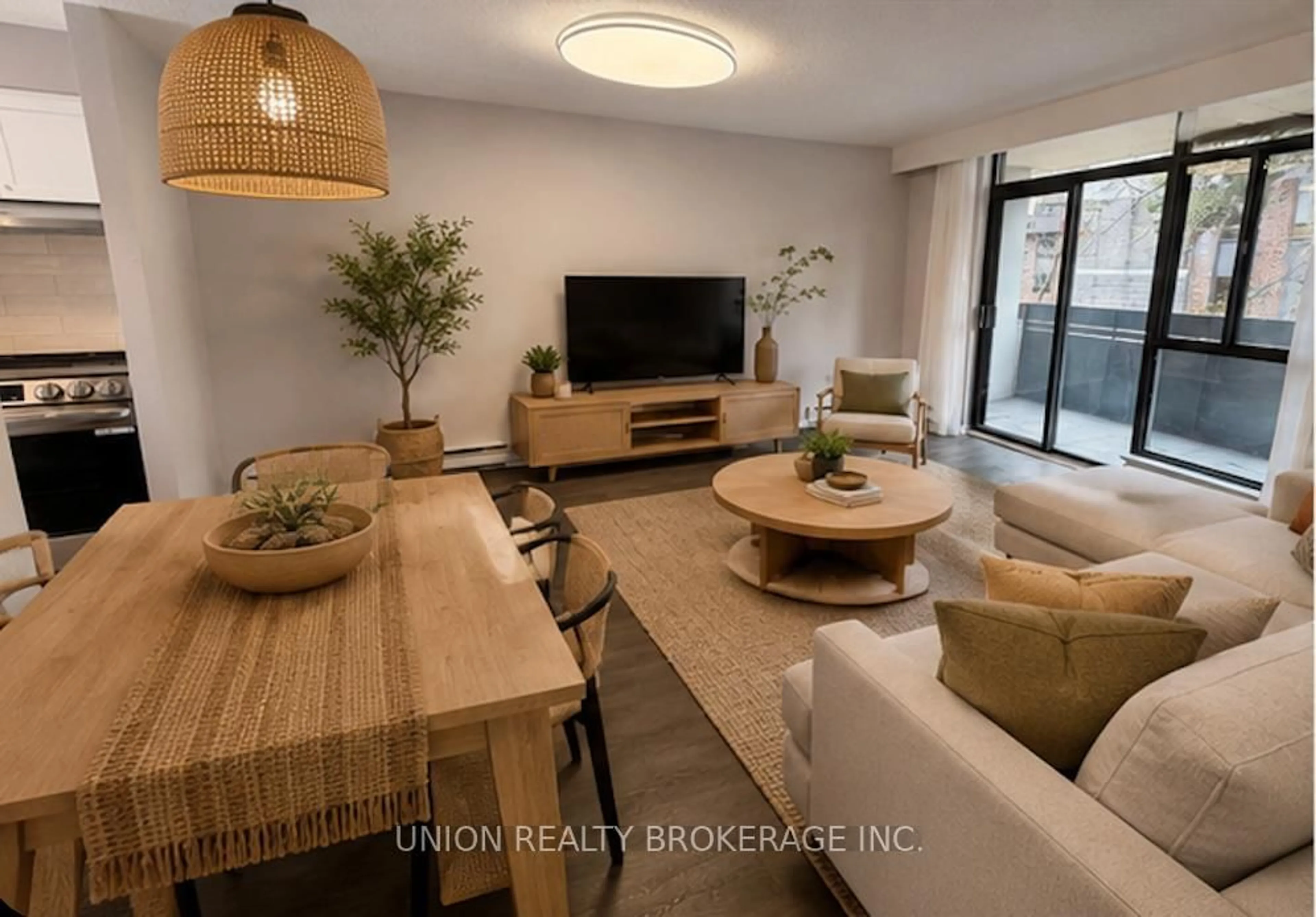 Living room with furniture, wood/laminate floor for 50 Old Kingston Rd #1-304, Toronto Ontario M1E 4Y1
