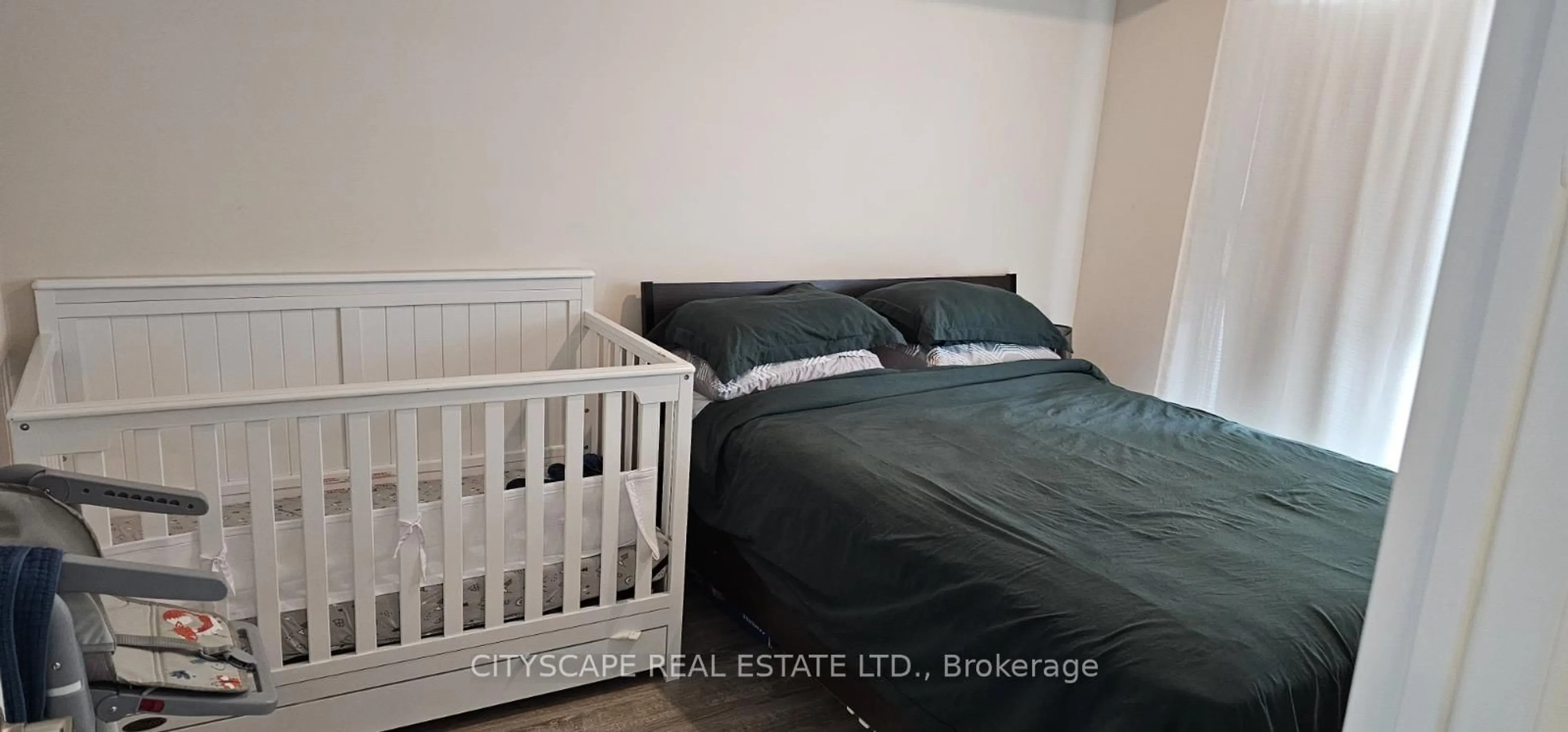 Bedroom with bed, wood/laminate floor for 2152 Lawrence Ave #606, Toronto Ontario M1R 0B5