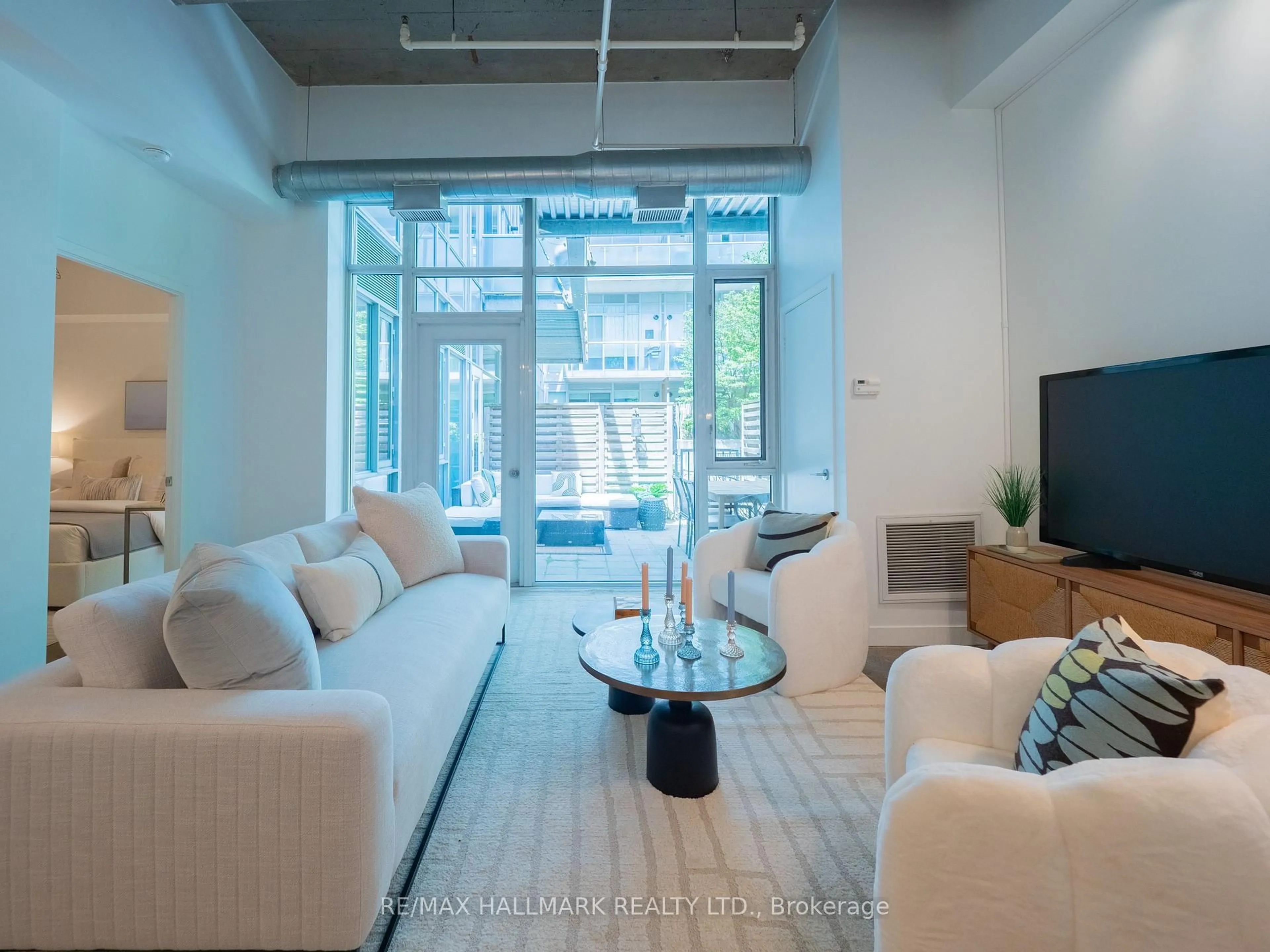 Living room with furniture, unknown for 201 Carlaw Ave #112, Toronto Ontario M4M 2S3