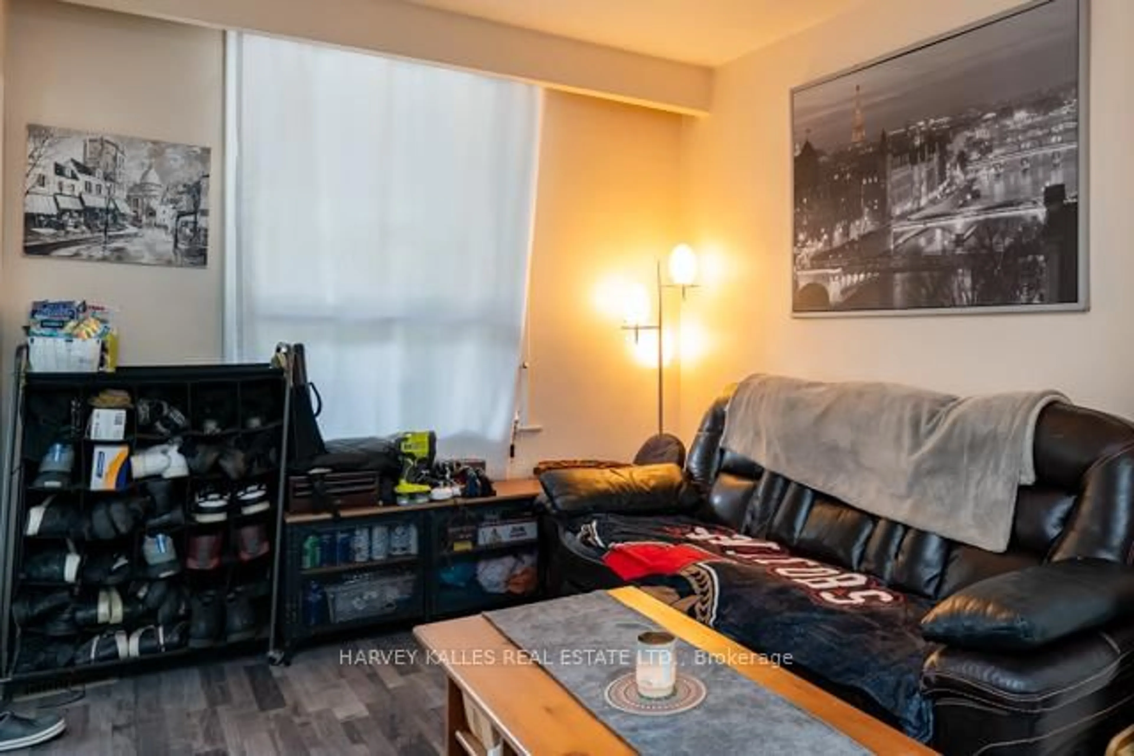 Living room with furniture, wood/laminate floor for 56 Amroth Ave, Toronto Ontario M4C 4H2