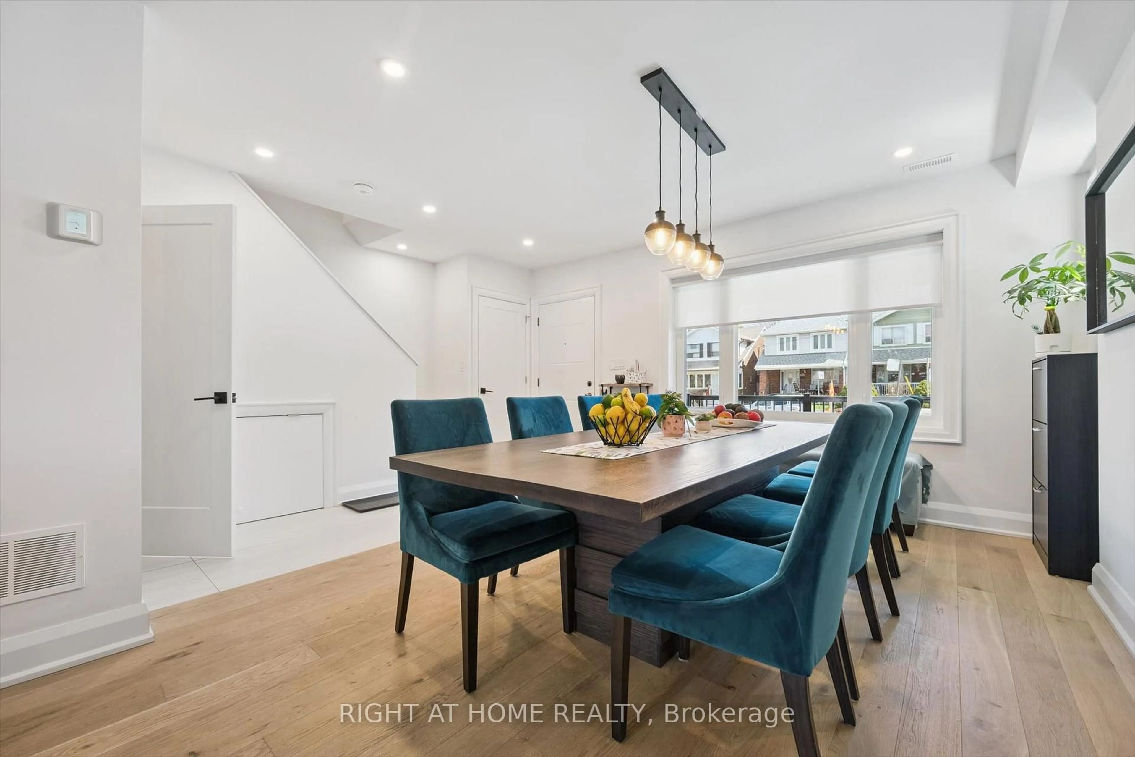 Dining room, wood/laminate floor for 814 Coxwell Ave, Toronto Ontario M4C 3E6