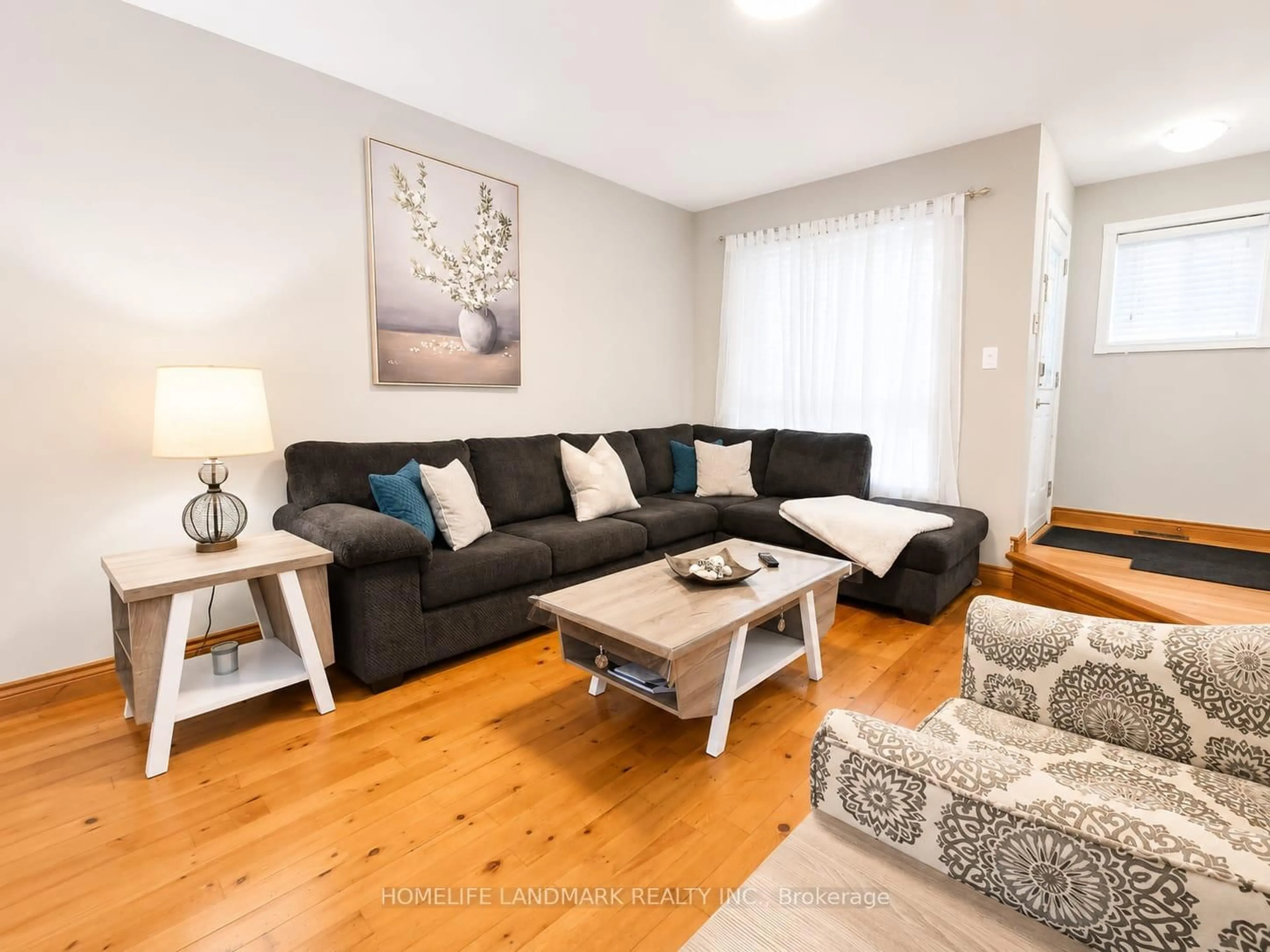 Living room with furniture, wood/laminate floor for 12 Millington Cres, Ajax Ontario L1T 1R1