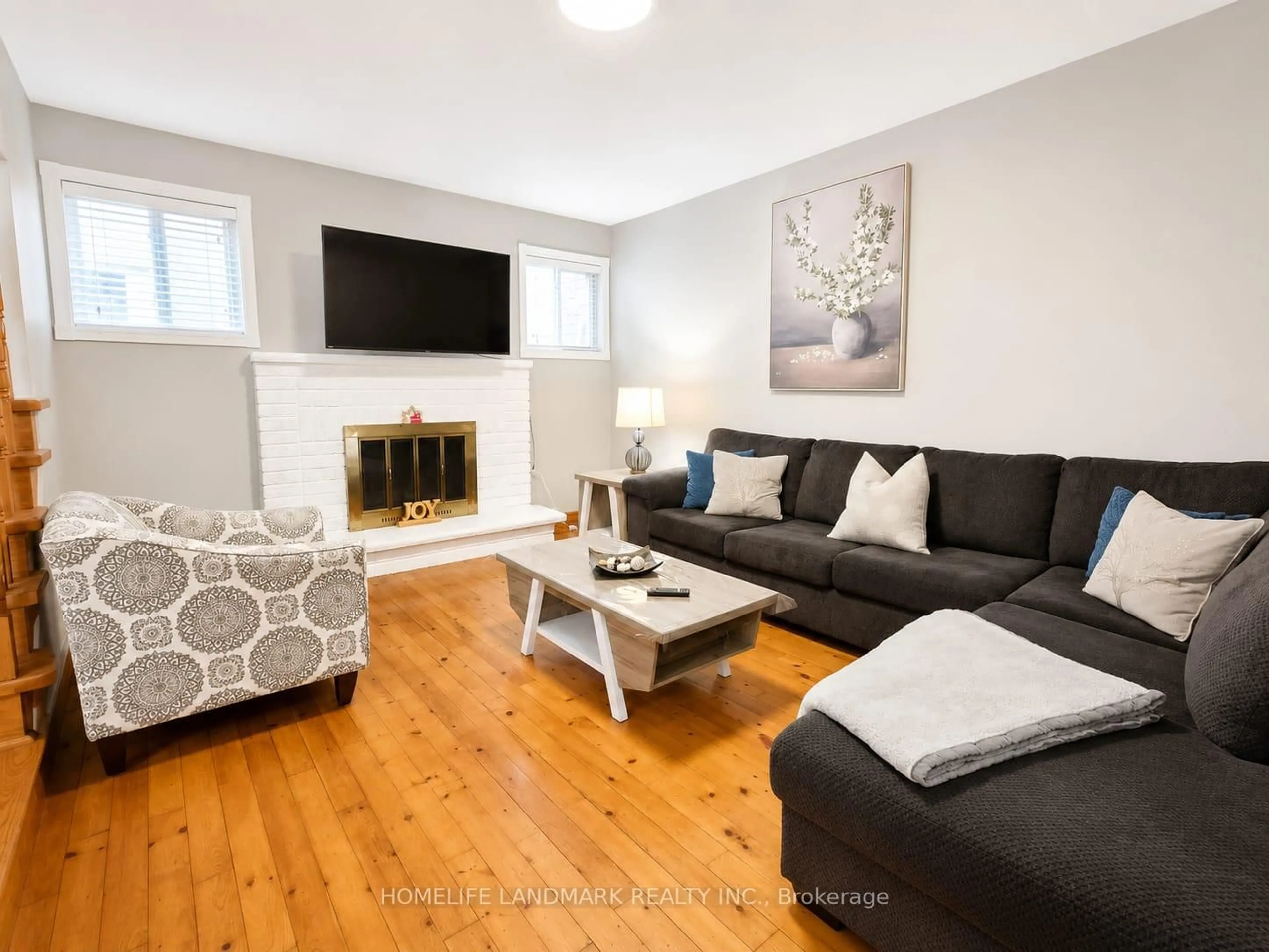 Living room with furniture, wood/laminate floor for 12 Millington Cres, Ajax Ontario L1T 1R1