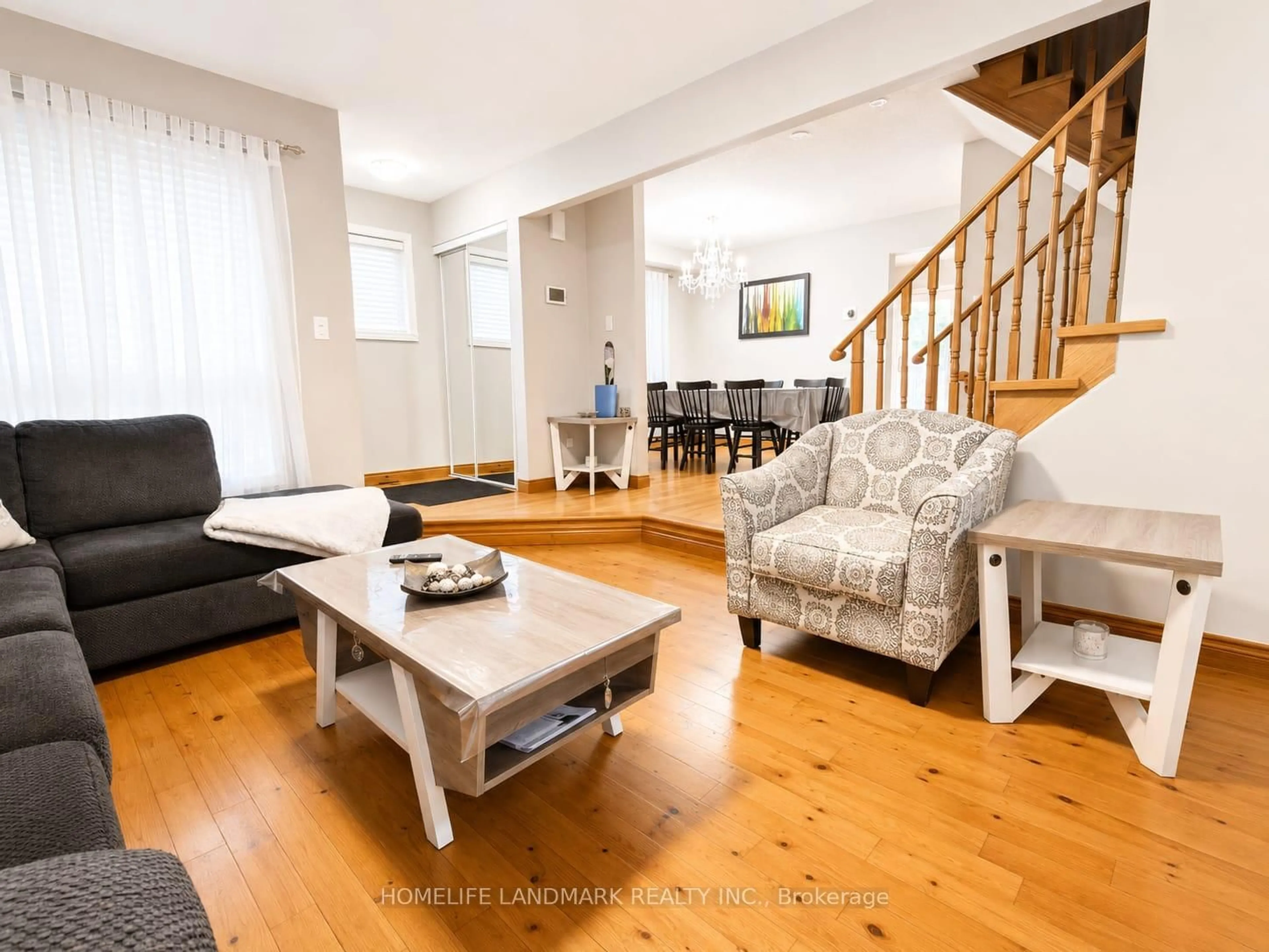 Living room with furniture, wood/laminate floor for 12 Millington Cres, Ajax Ontario L1T 1R1