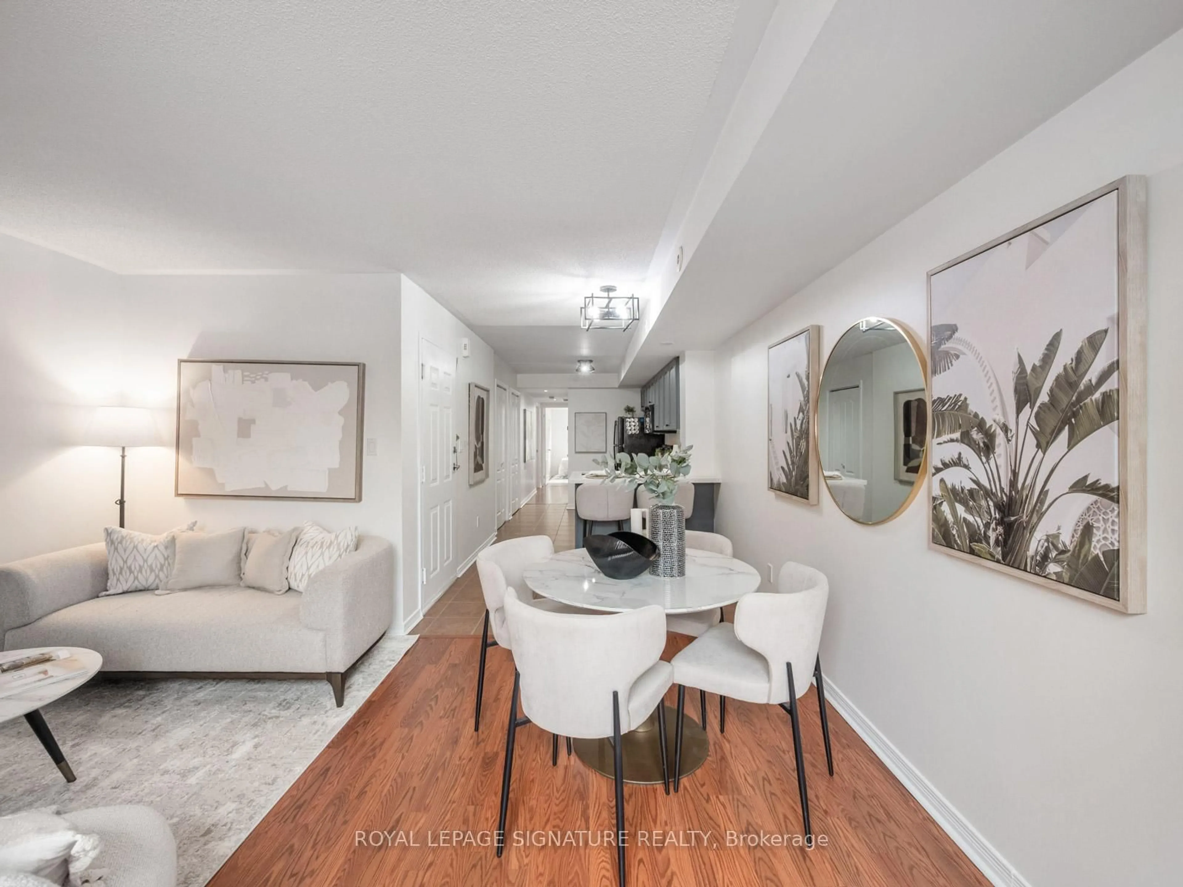 Living room with furniture, wood/laminate floor for 45 Strangford Lane #201, Toronto Ontario M1L 0E5