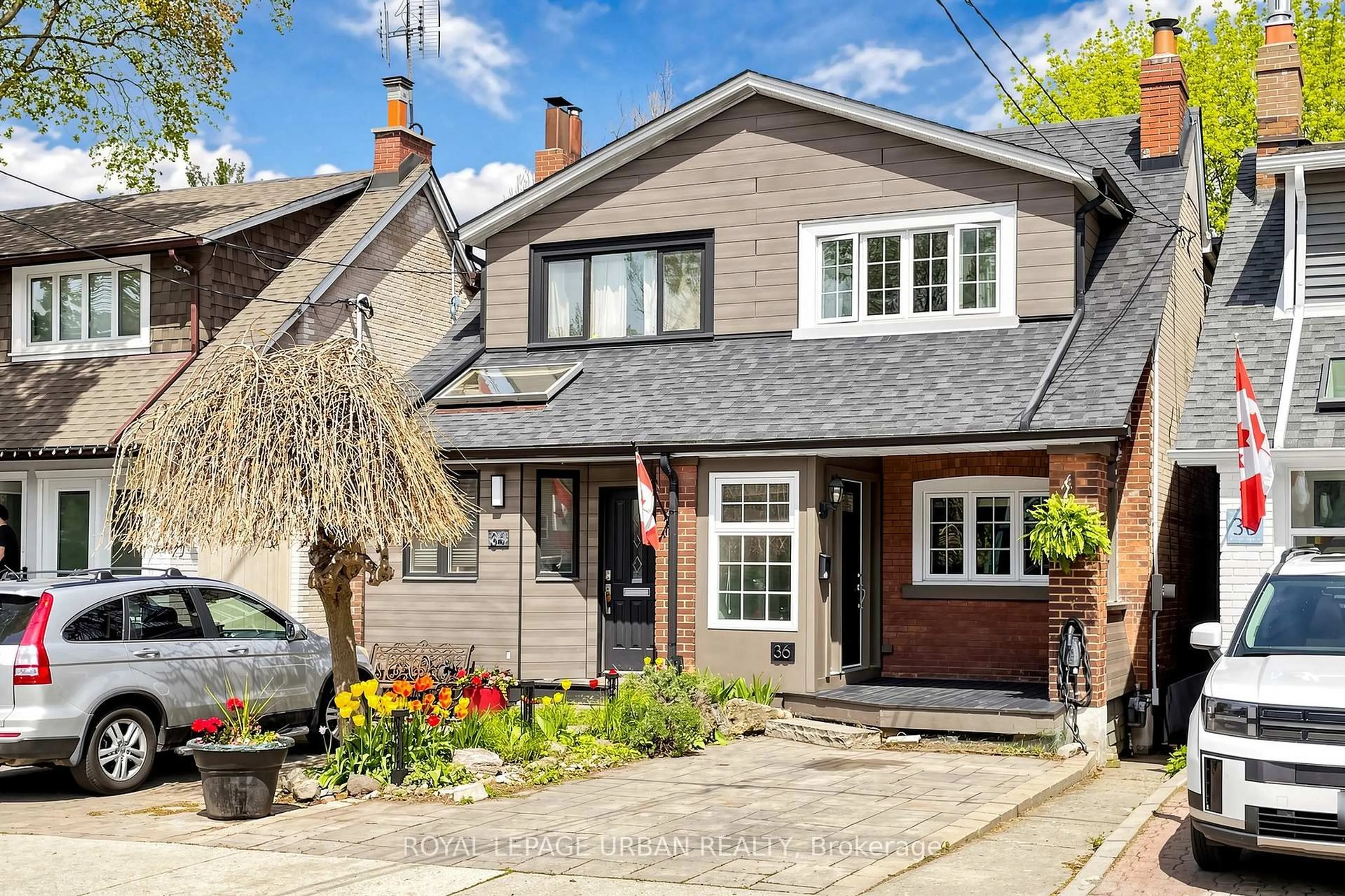 Home with brick exterior material, street for 36 Norway Ave, Toronto Ontario M4L 1P9