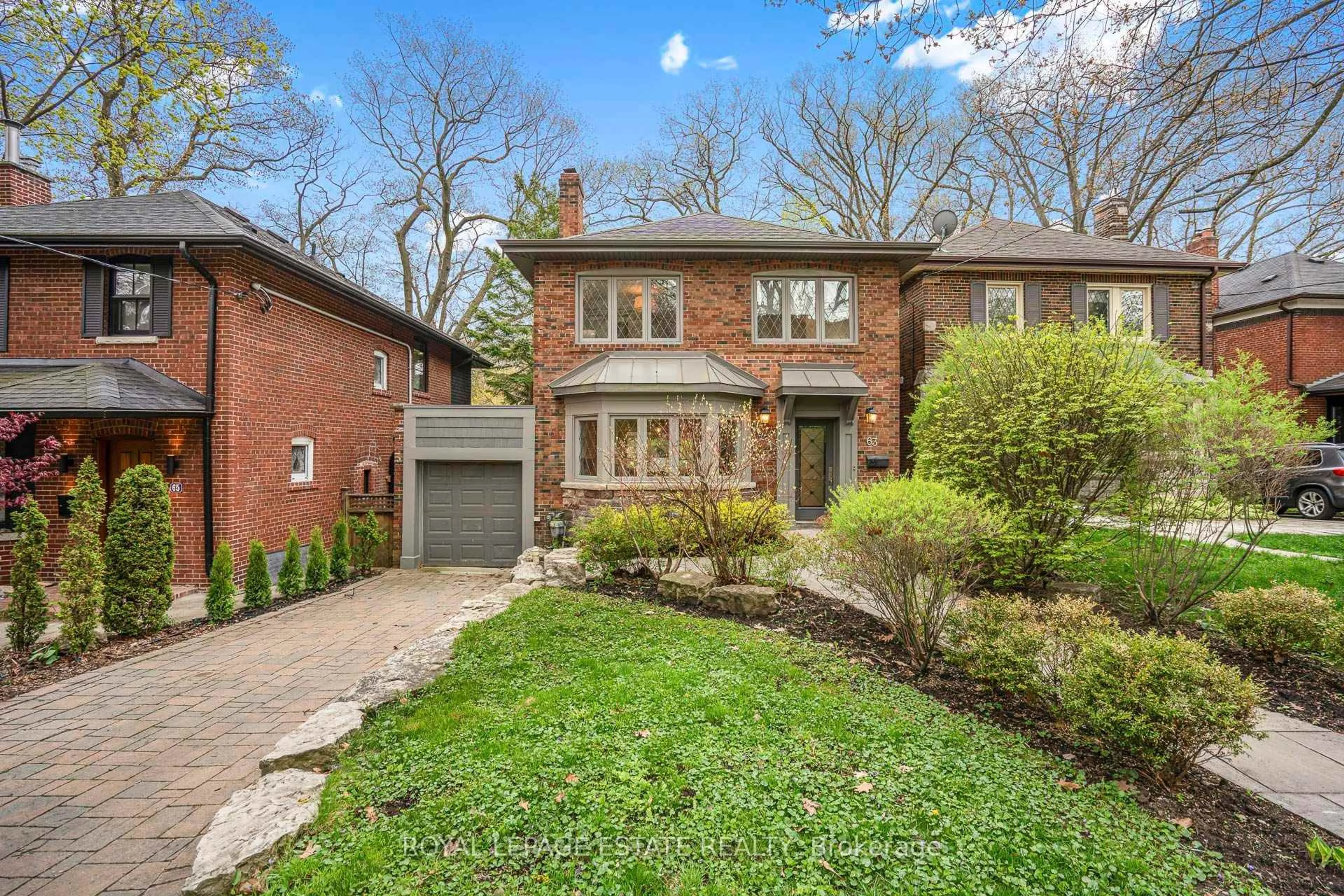 Home with brick exterior material, street for 63 Beaufort Rd, Toronto Ontario M4E 1M8