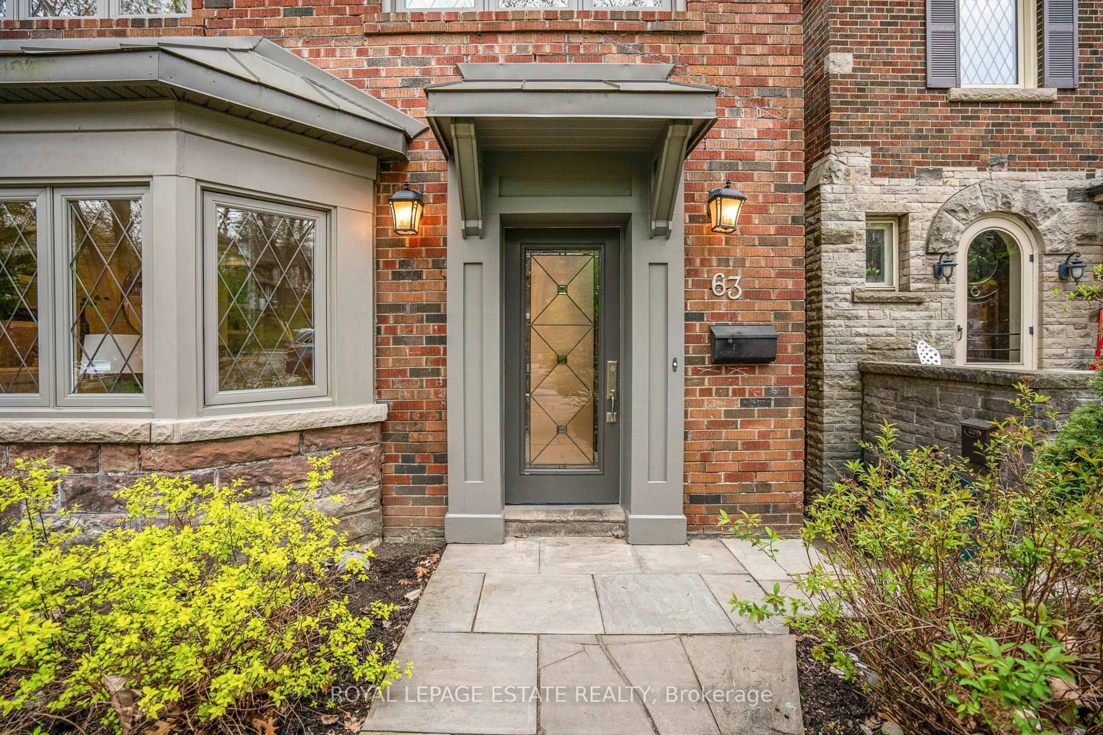 Home with brick exterior material, street for 63 Beaufort Rd, Toronto Ontario M4E 1M8