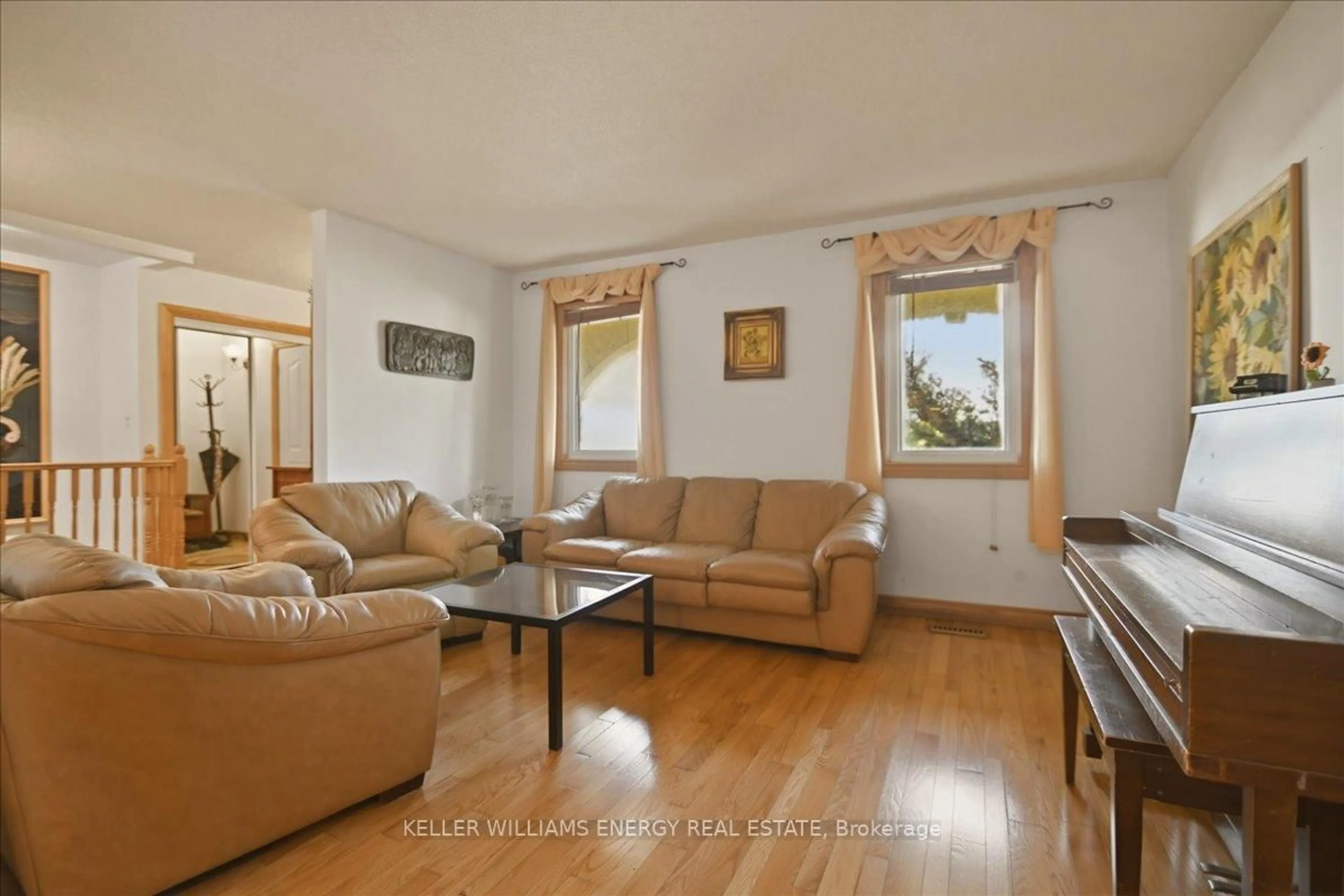 Living room with furniture, wood/laminate floor for 2033 Simcoe St, Oshawa Ontario L1H 7K4