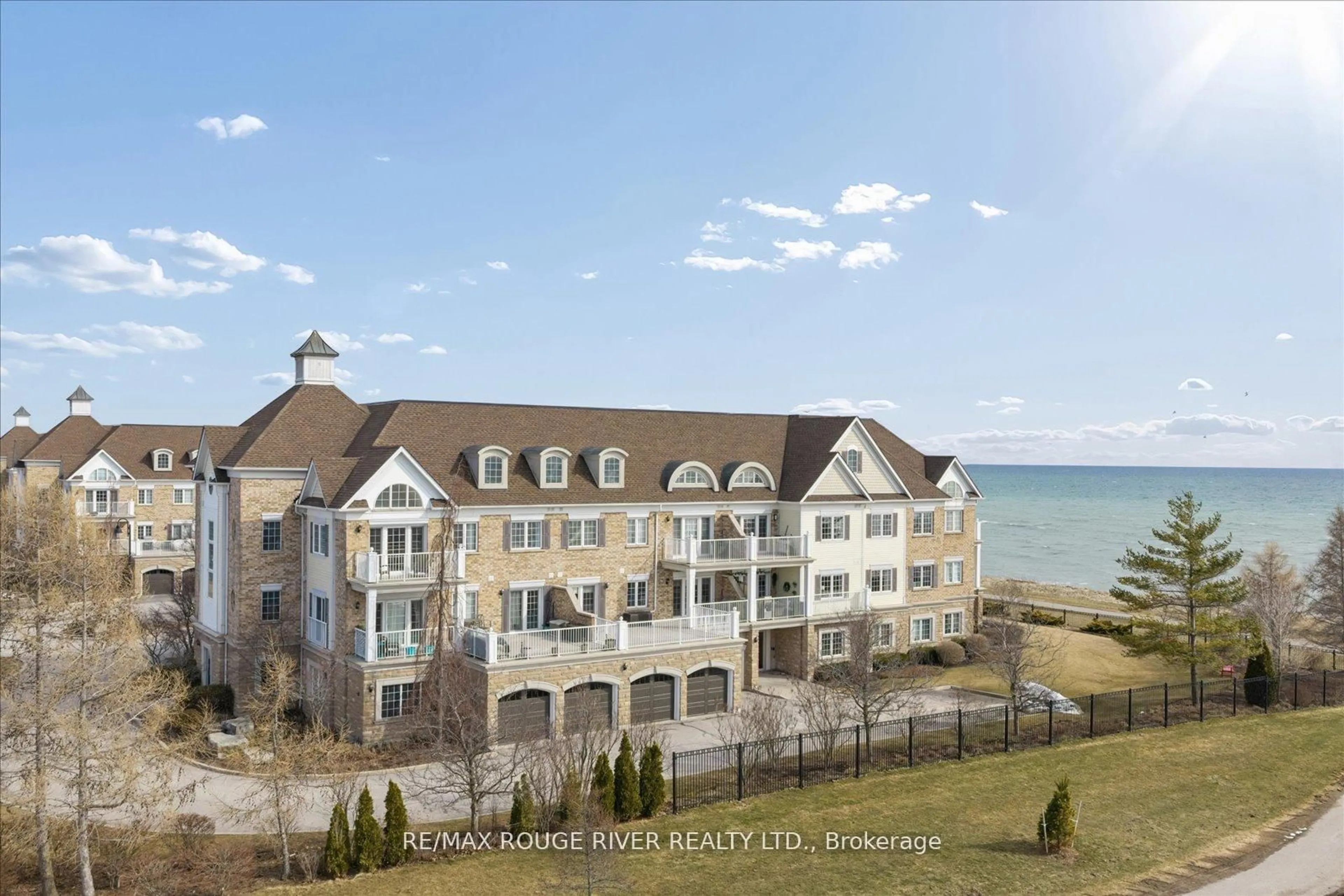 A pic from outside/outdoor area/front of a property/back of a property/a pic from drone, water/lake/river/ocean view for 395 Lakebreeze Dr #306, Clarington Ontario L1B 0A5