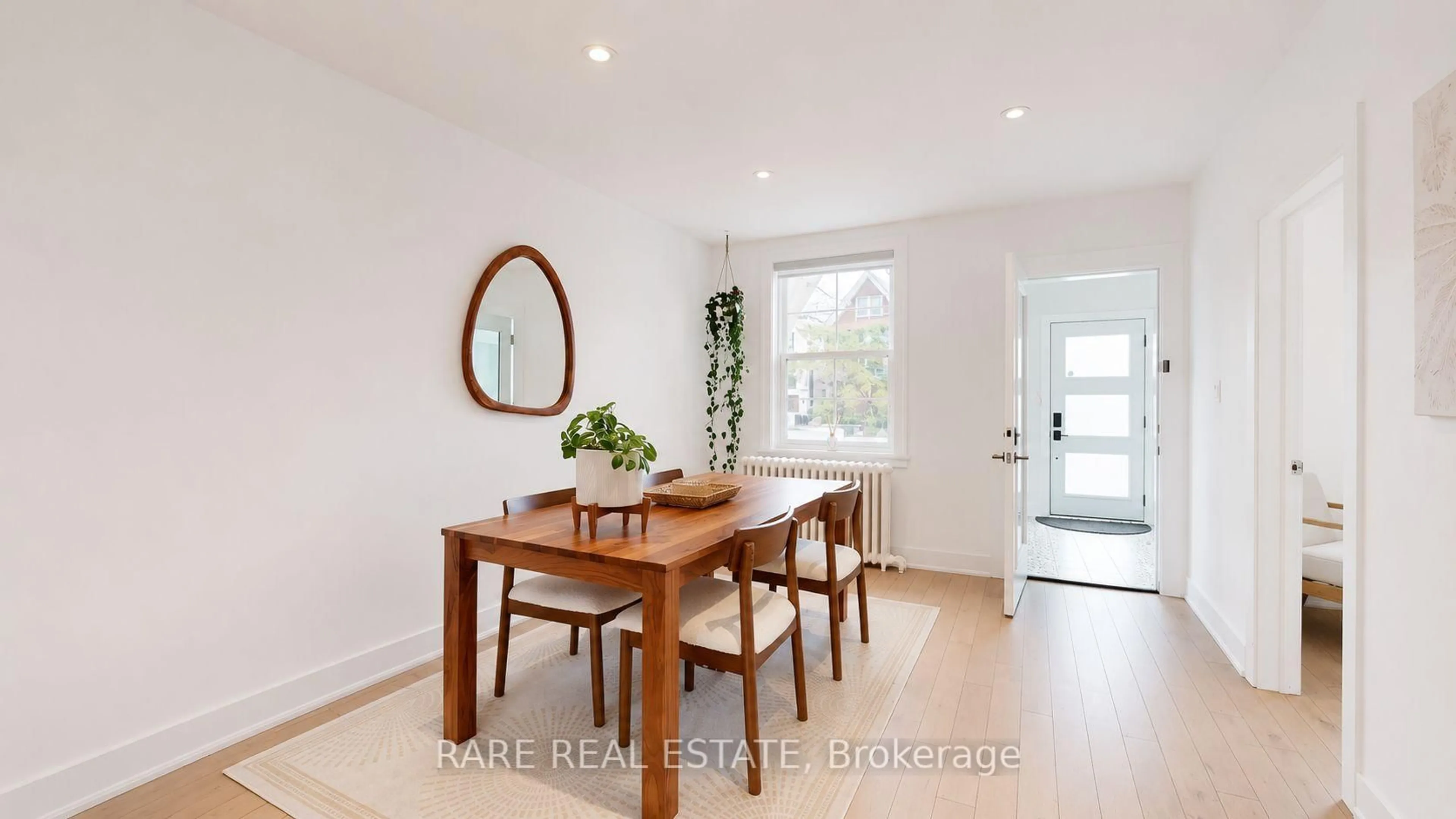 Dining room, wood/laminate floor for 48 Redwood Ave, Toronto Ontario M4L 2S6