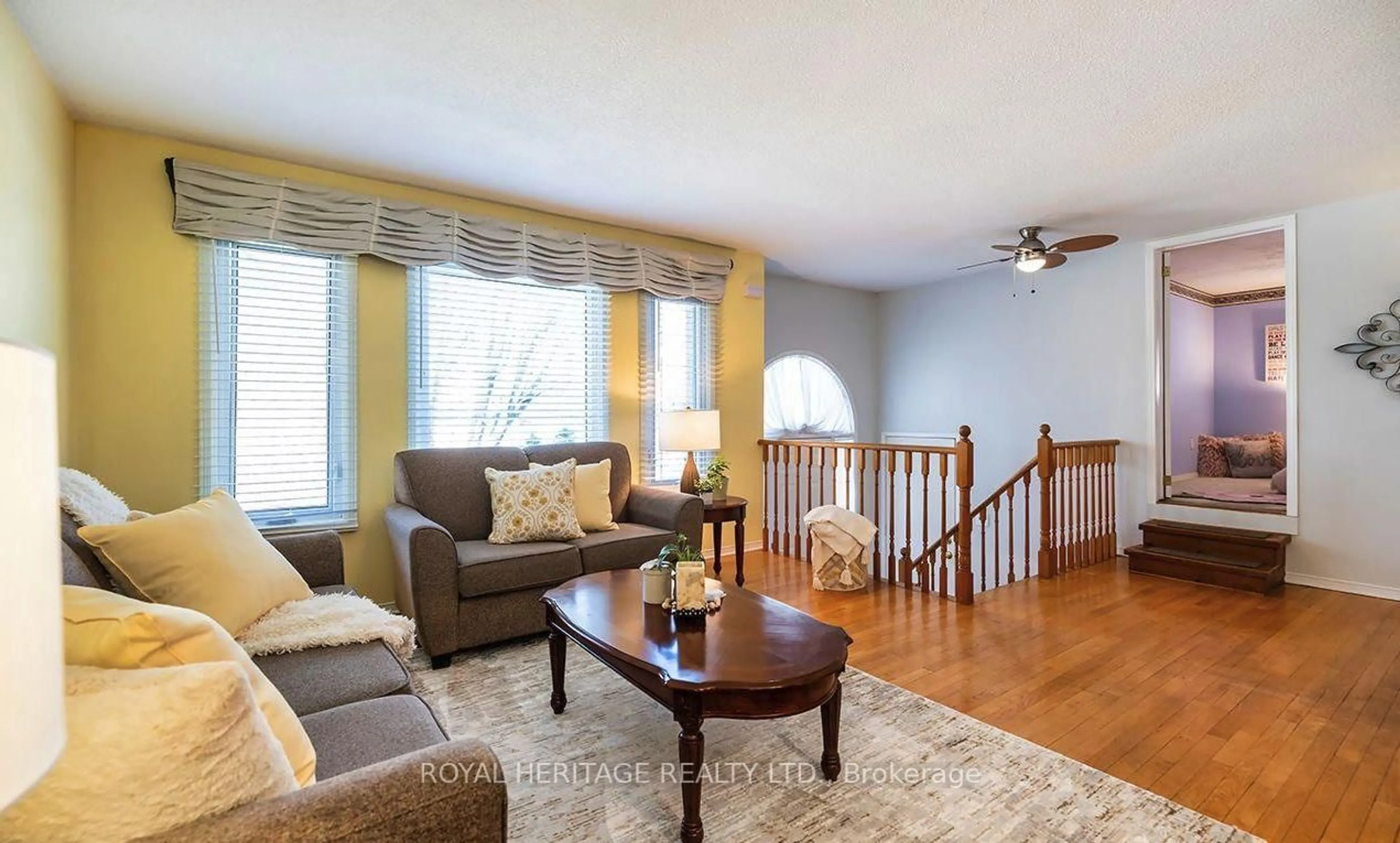 Living room with furniture, wood/laminate floor for 31 Thames Dr, Whitby Ontario L1R 2M2