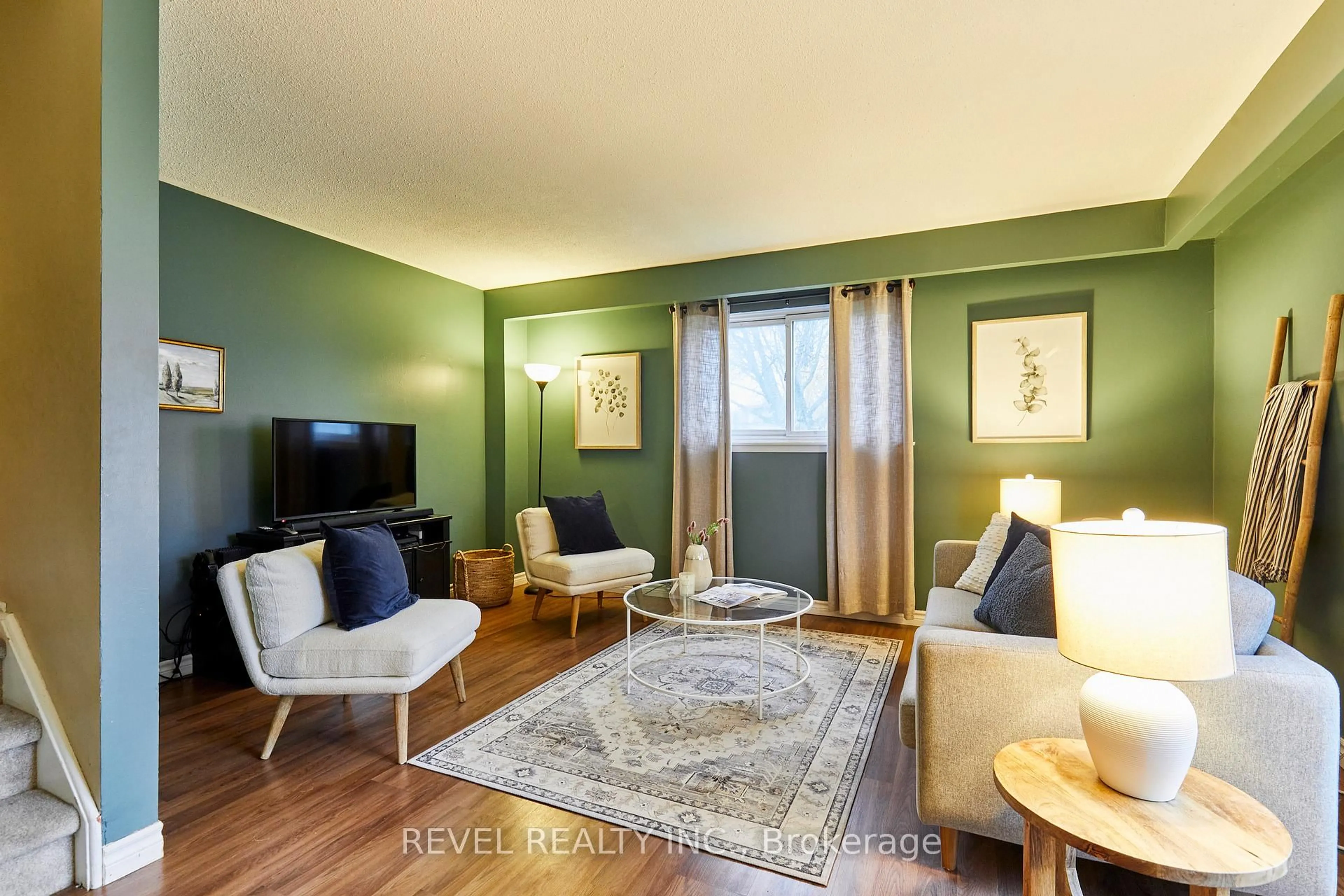 Living room with furniture, wood/laminate floor for 689 Gibb St, Oshawa Ontario L1J 1Z8