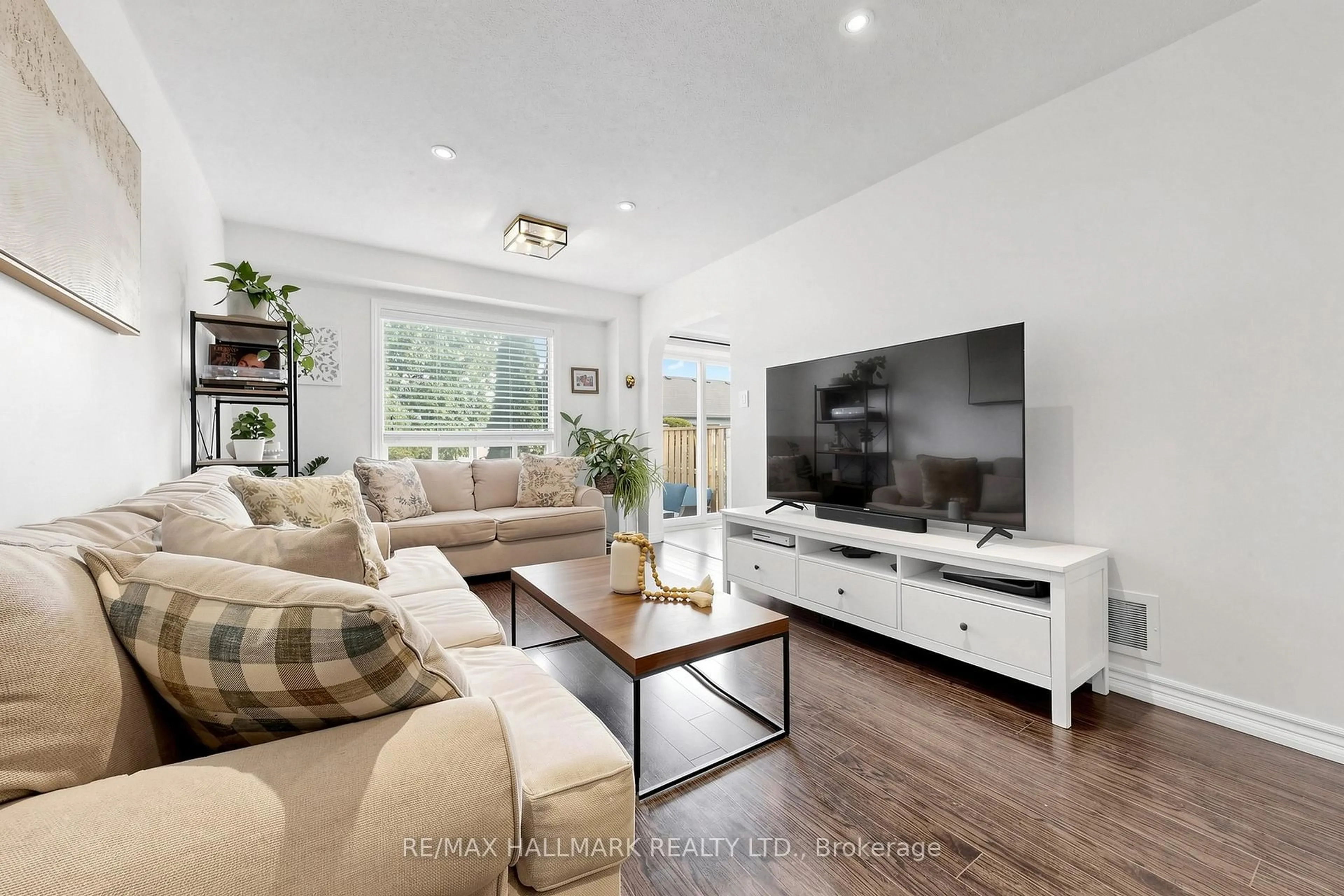 Living room with furniture, wood/laminate floor for 10 Bassett Blvd #189, Whitby Ontario L1N 9C7