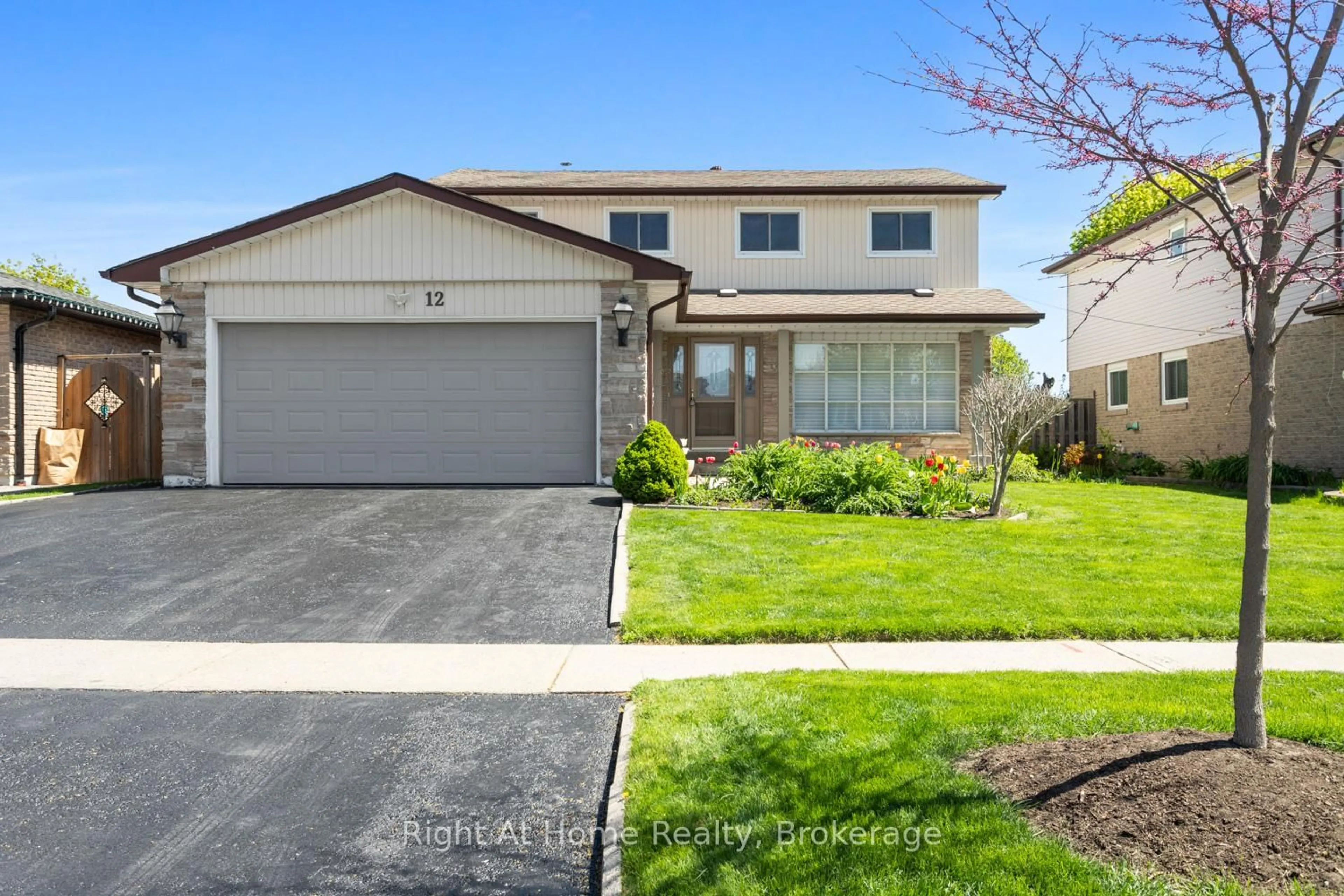 Home with vinyl exterior material, street for 12 Pittmann Cres, Ajax Ontario L1S 3G3