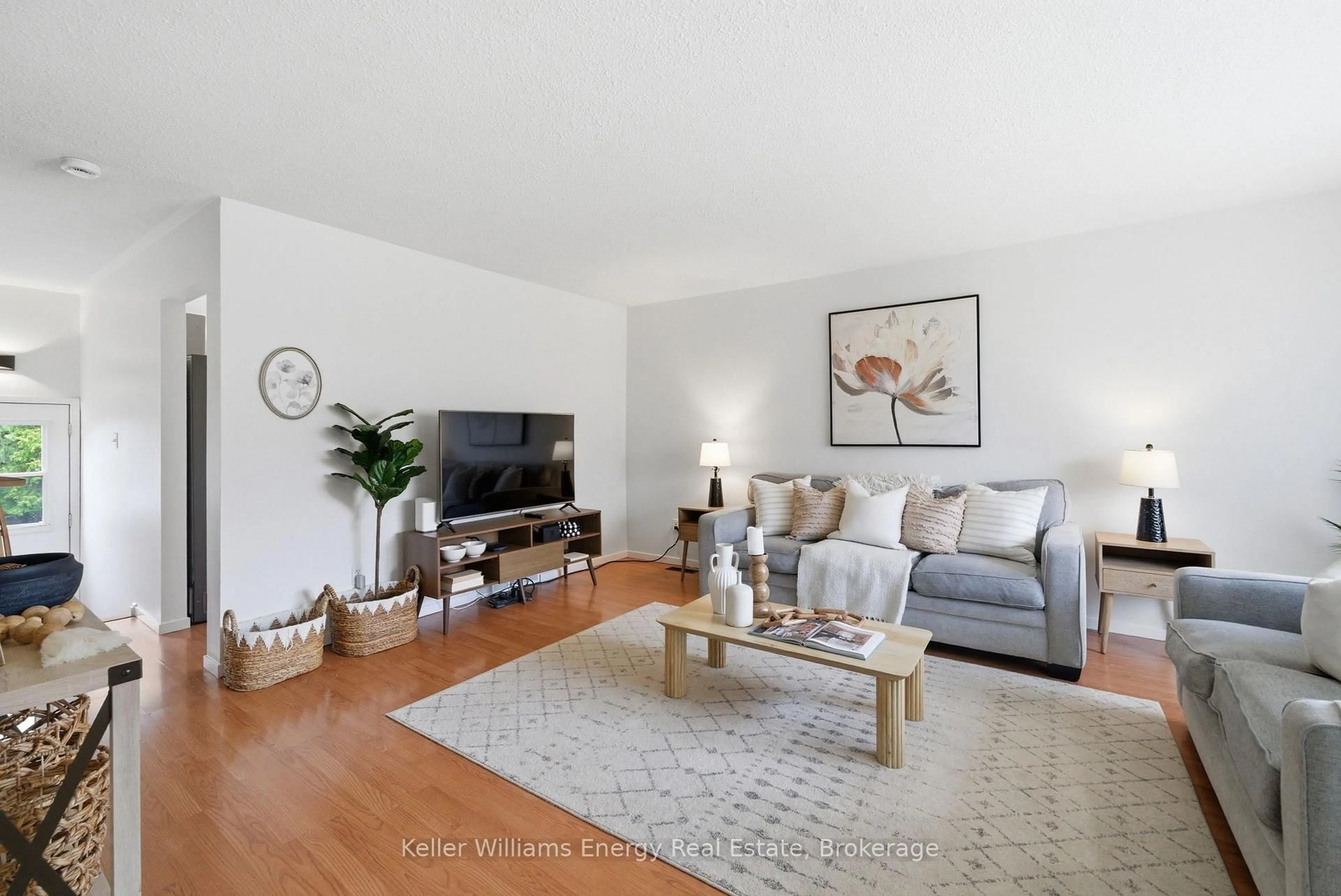 Living room with furniture, wood/laminate floor for 441 Maplewood Dr, Oshawa Ontario L1G 5R7