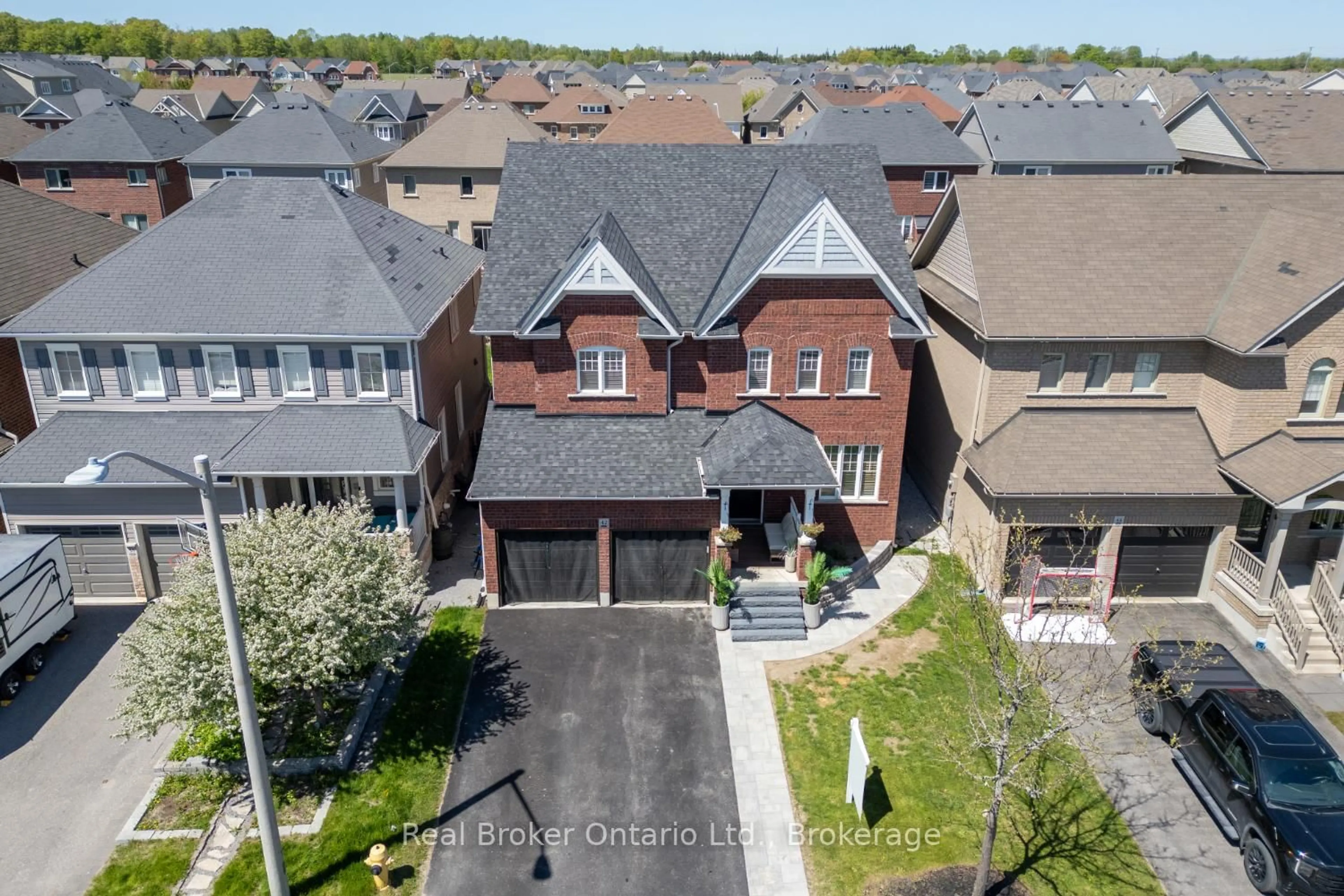 A pic from outside/outdoor area/front of a property/back of a property/a pic from drone, street for 42 Ted Miller Cres, Clarington Ontario L1C 0L8