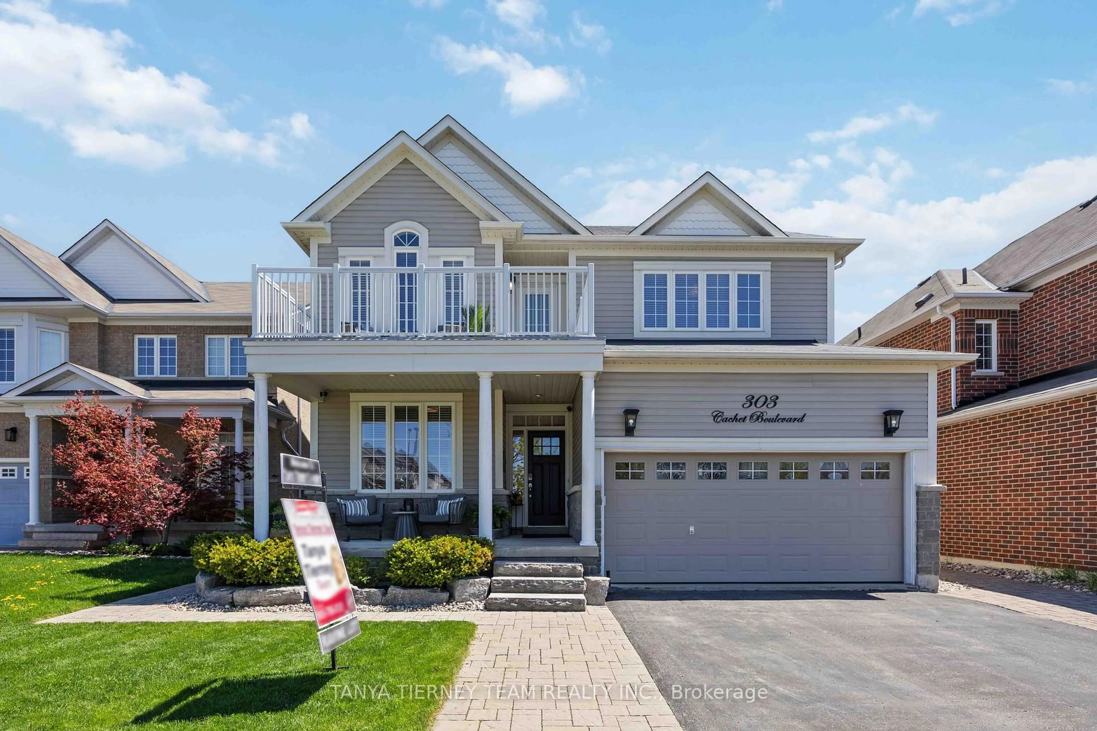 Home with vinyl exterior material, street for 303 Cachet Blvd, Whitby Ontario L1M 0C7