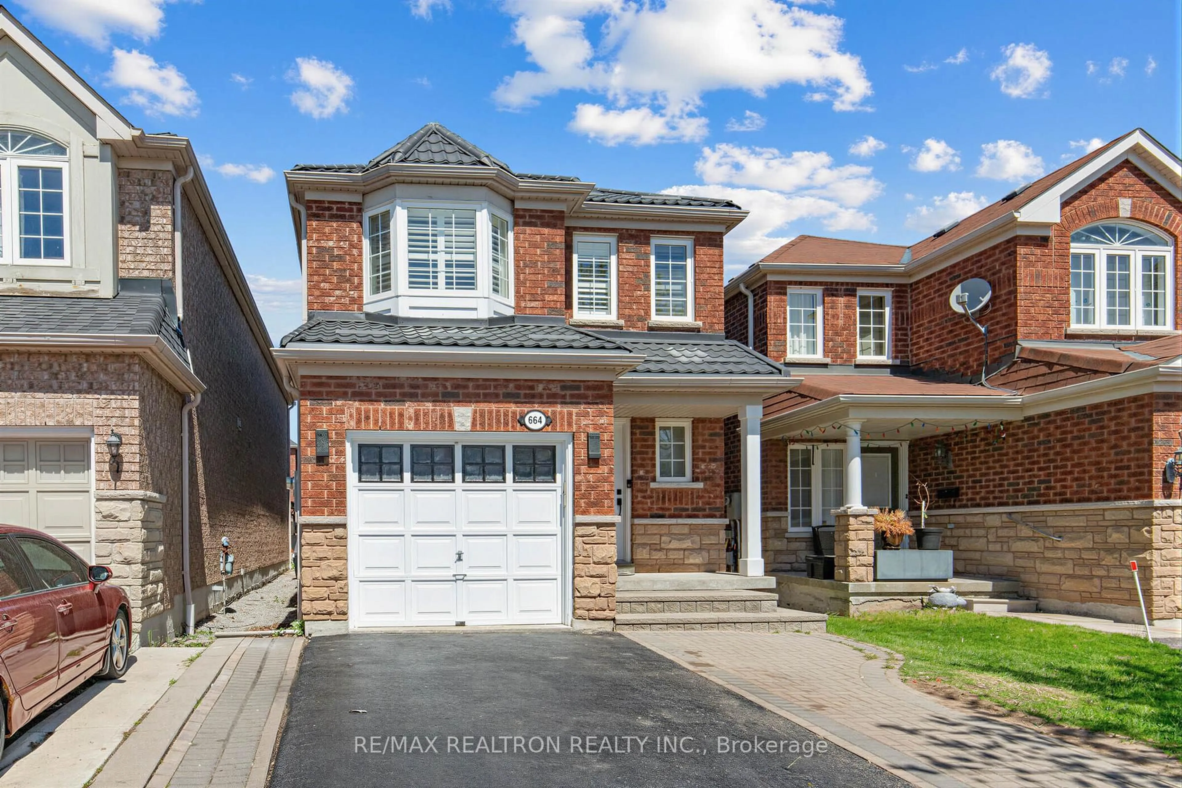 Home with brick exterior material, street for 664 Sunbird Tr, Pickering Ontario L1X 2X6