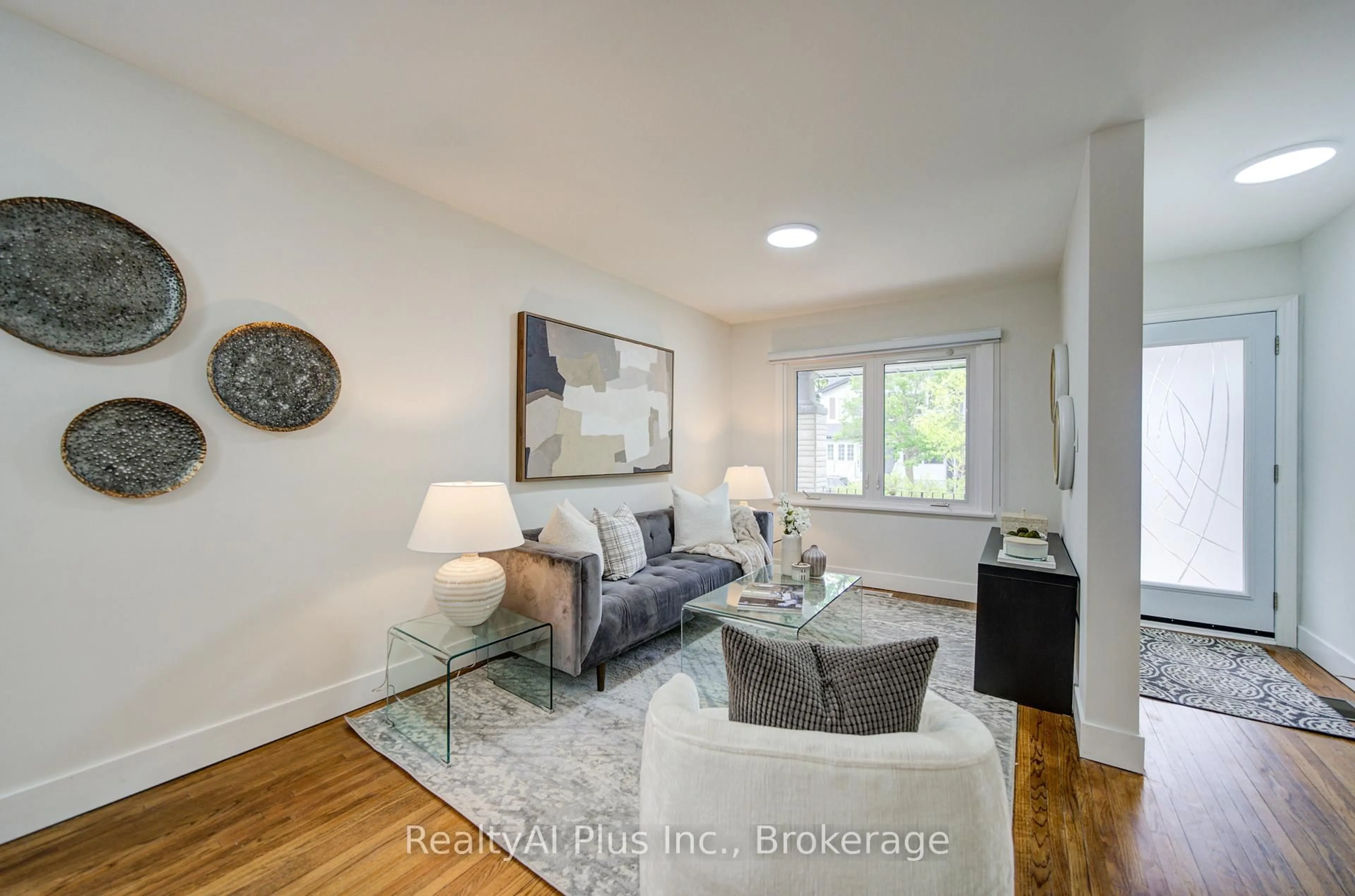 Living room with furniture, wood/laminate floor for 14 Athletic Ave, Toronto Ontario M4L 1W6