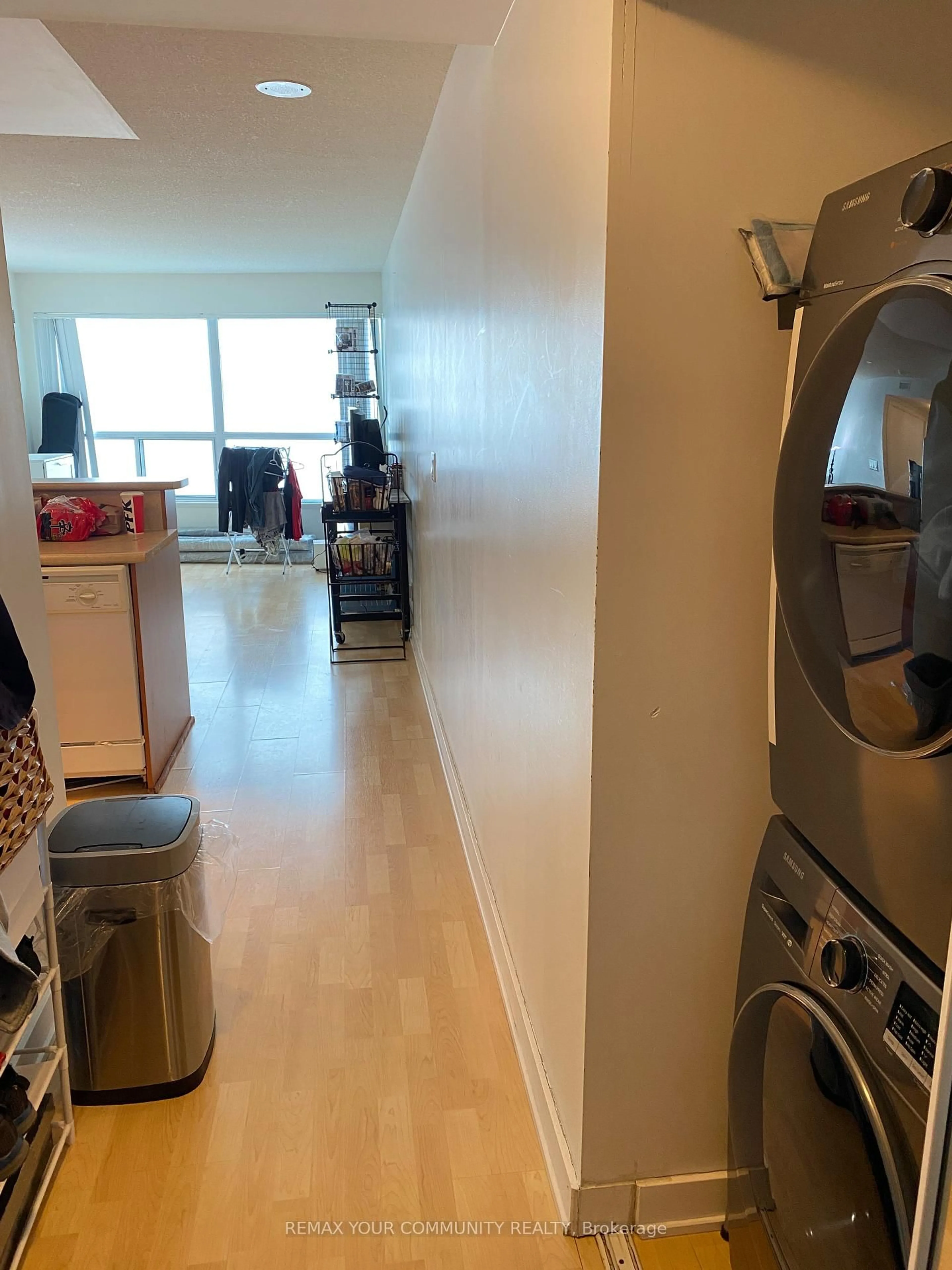 Kitchen with laundary machines, floor is not visible for 38 Lee Centre Dr #3002, Toronto Ontario M1H 3J7