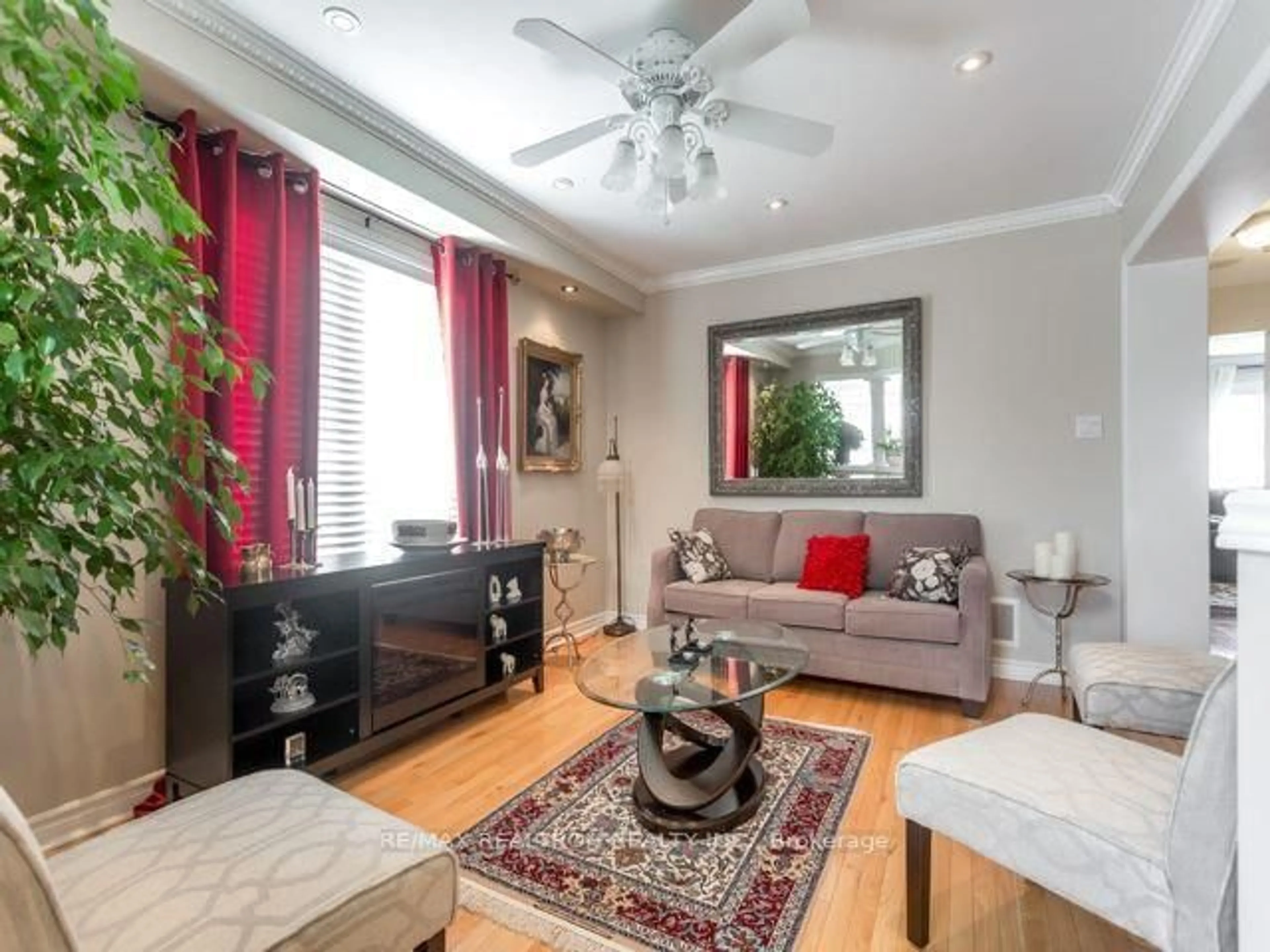 Living room with furniture, wood/laminate floor for 55 Belfountain Dr, Whitby Ontario L1R 0C4