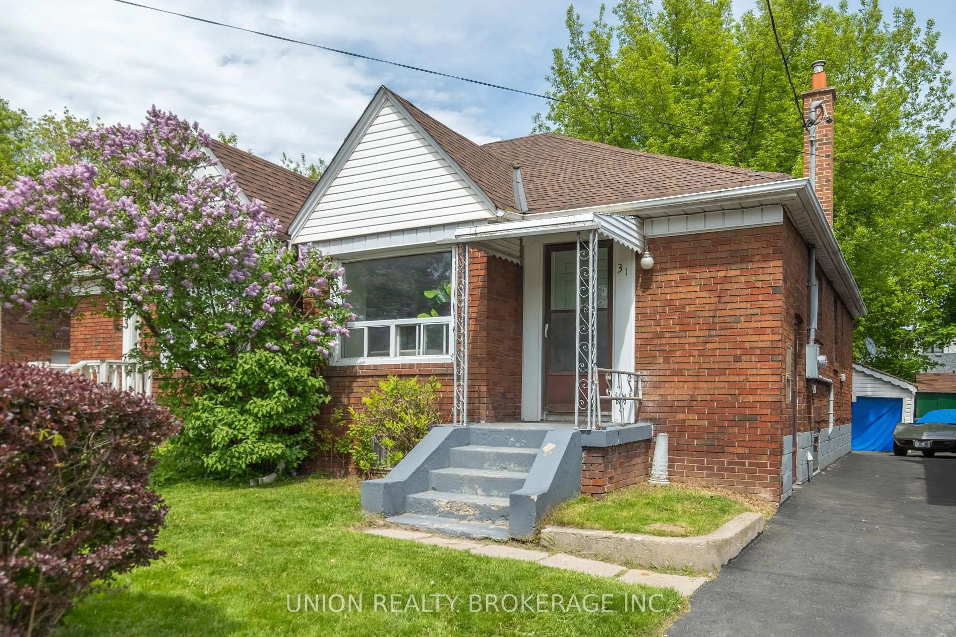 Home with brick exterior material, street for 31 Thora Ave, Toronto Ontario M1L 2P7