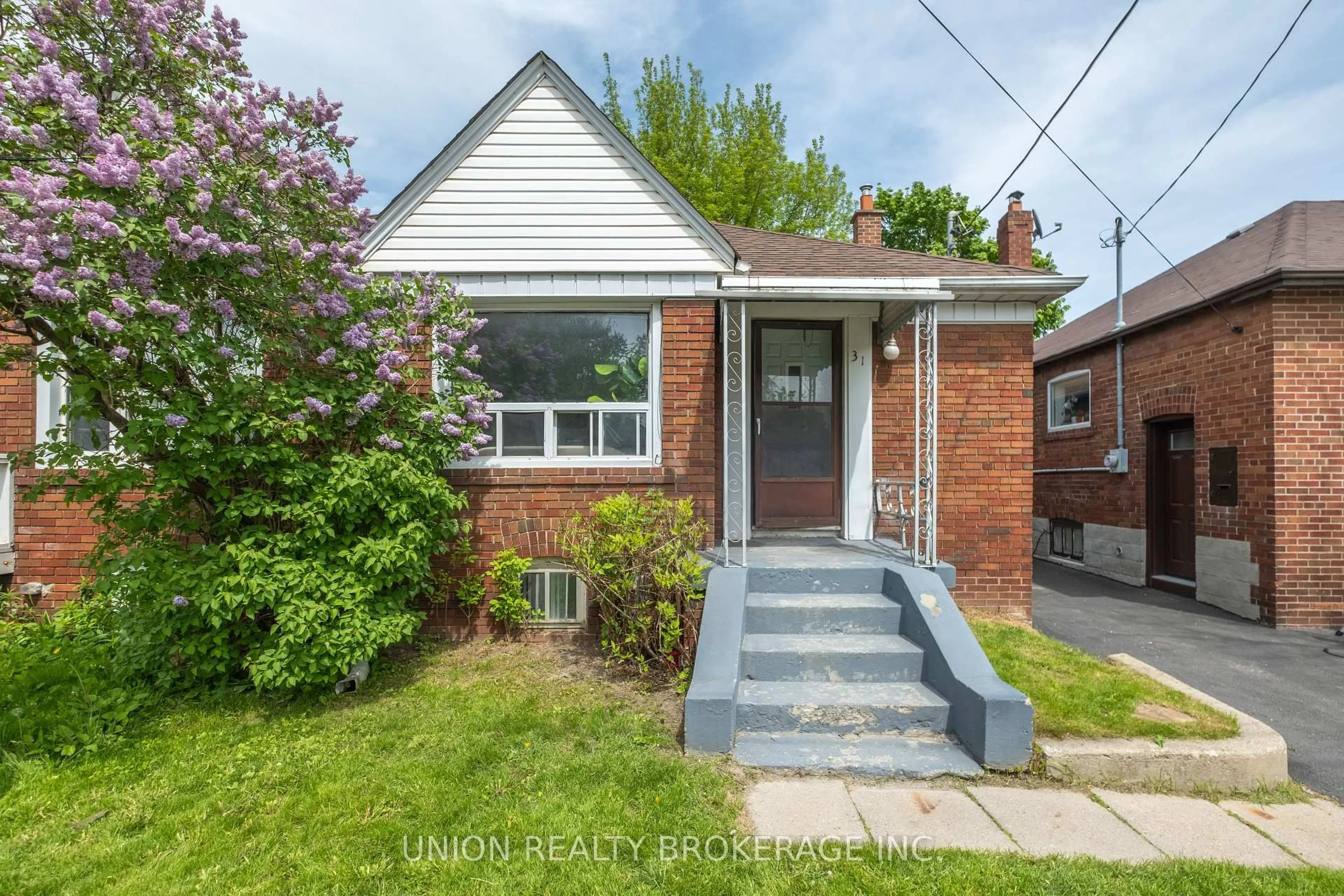 Home with brick exterior material, street for 31 Thora Ave, Toronto Ontario M1L 2P7