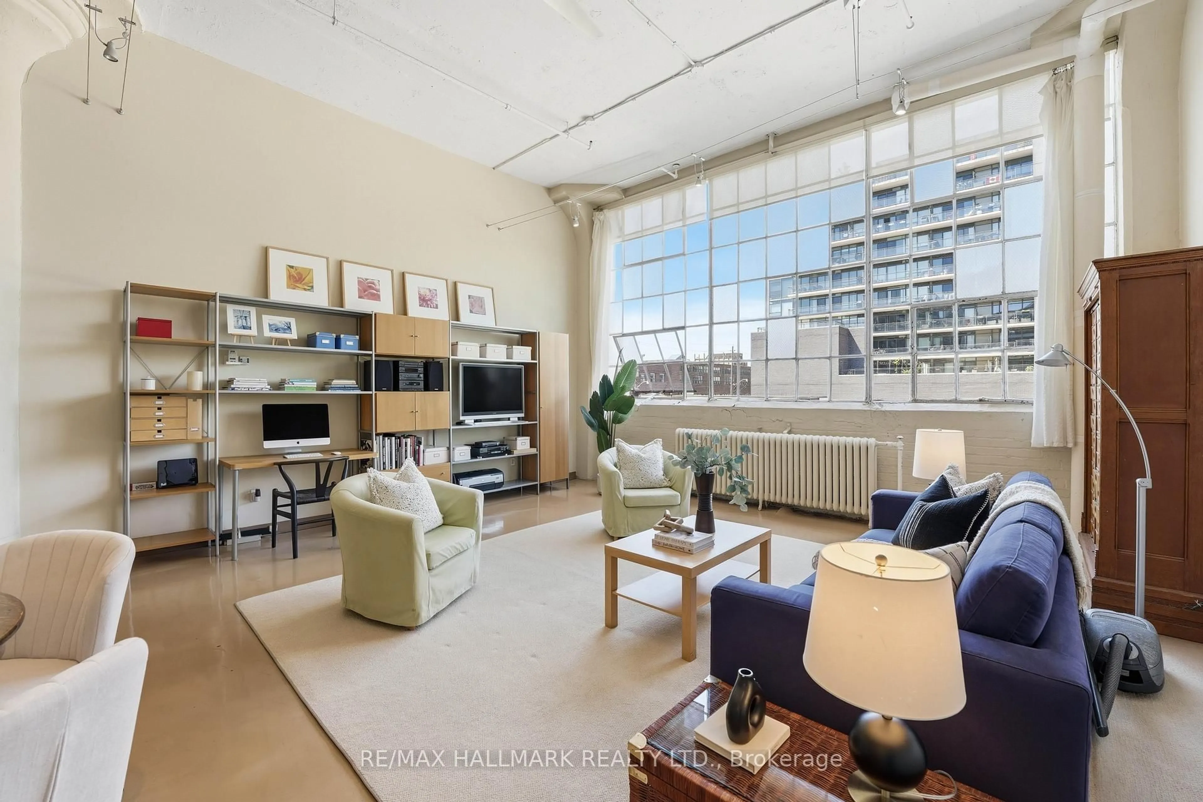 Living room with furniture, unknown for 245 Carlaw Ave #203, Toronto Ontario M4M 2S6