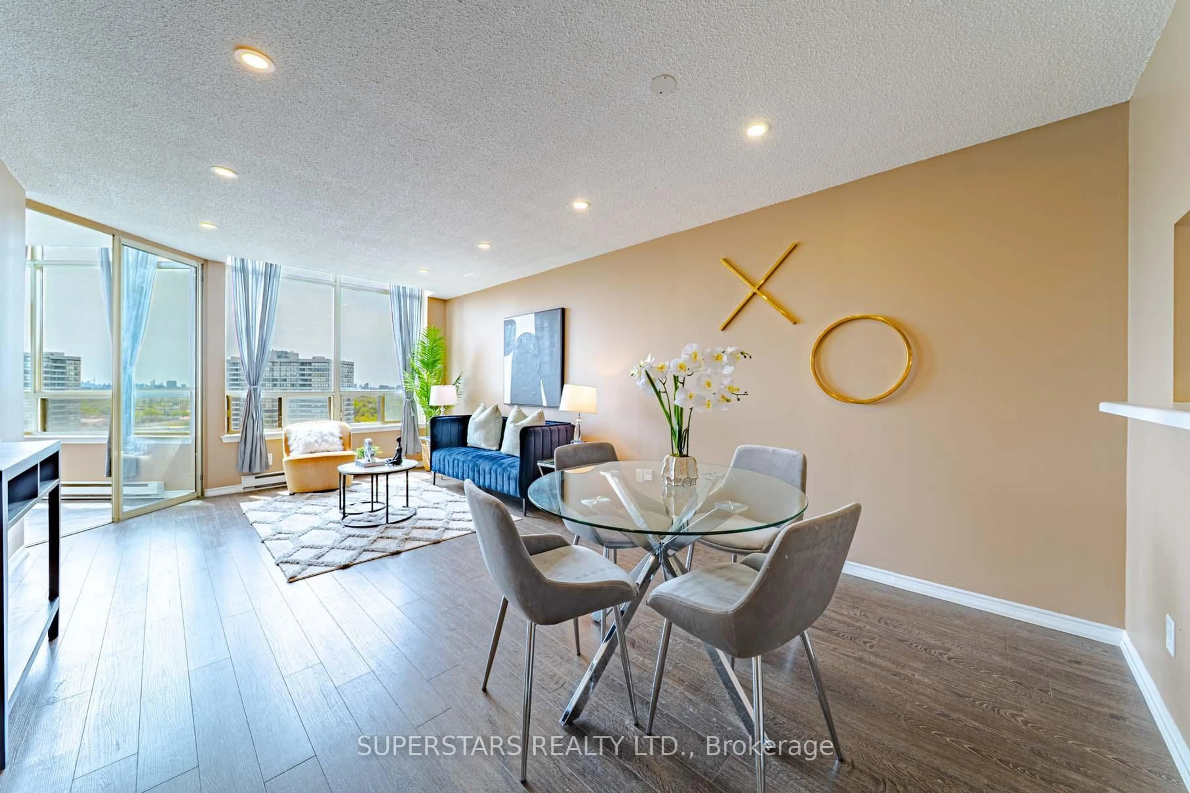 Living room with furniture, wood/laminate floor for 160 Alton Towers Circ #1813, Toronto Ontario M1V 4X8