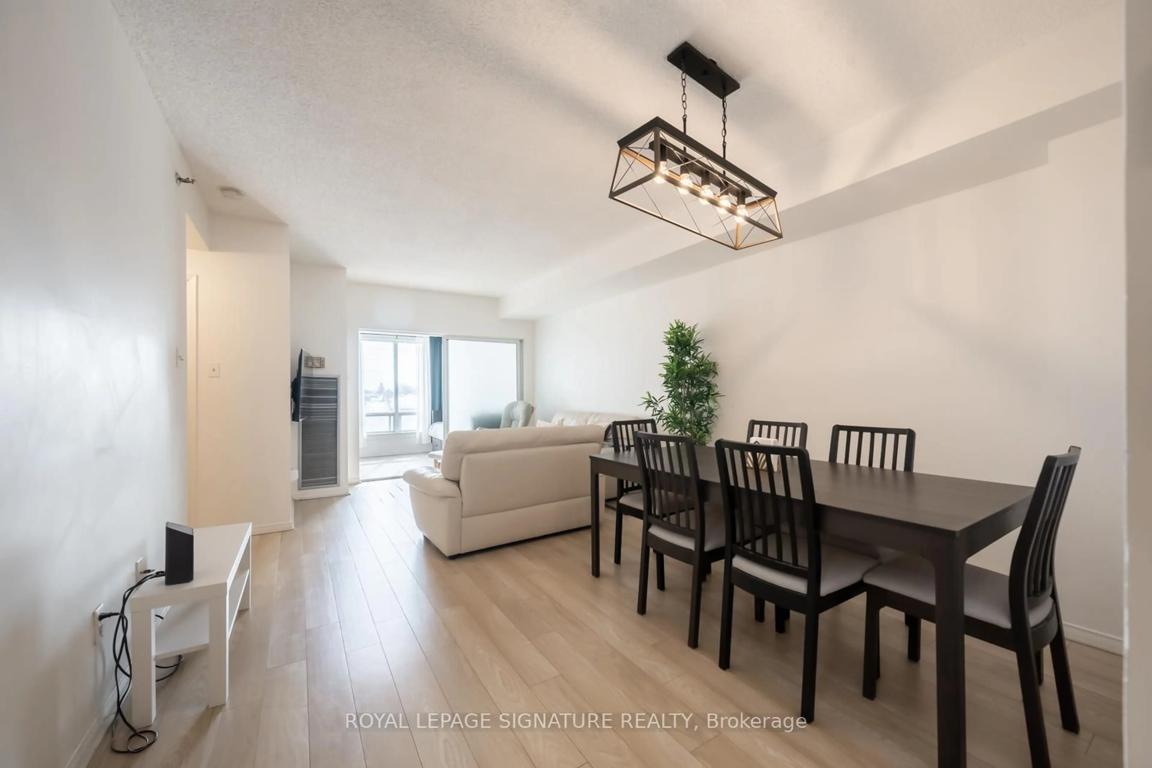 Living room with furniture, wood/laminate floor for 5800 Sheppard Ave #316, Toronto Ontario M1B 5J7