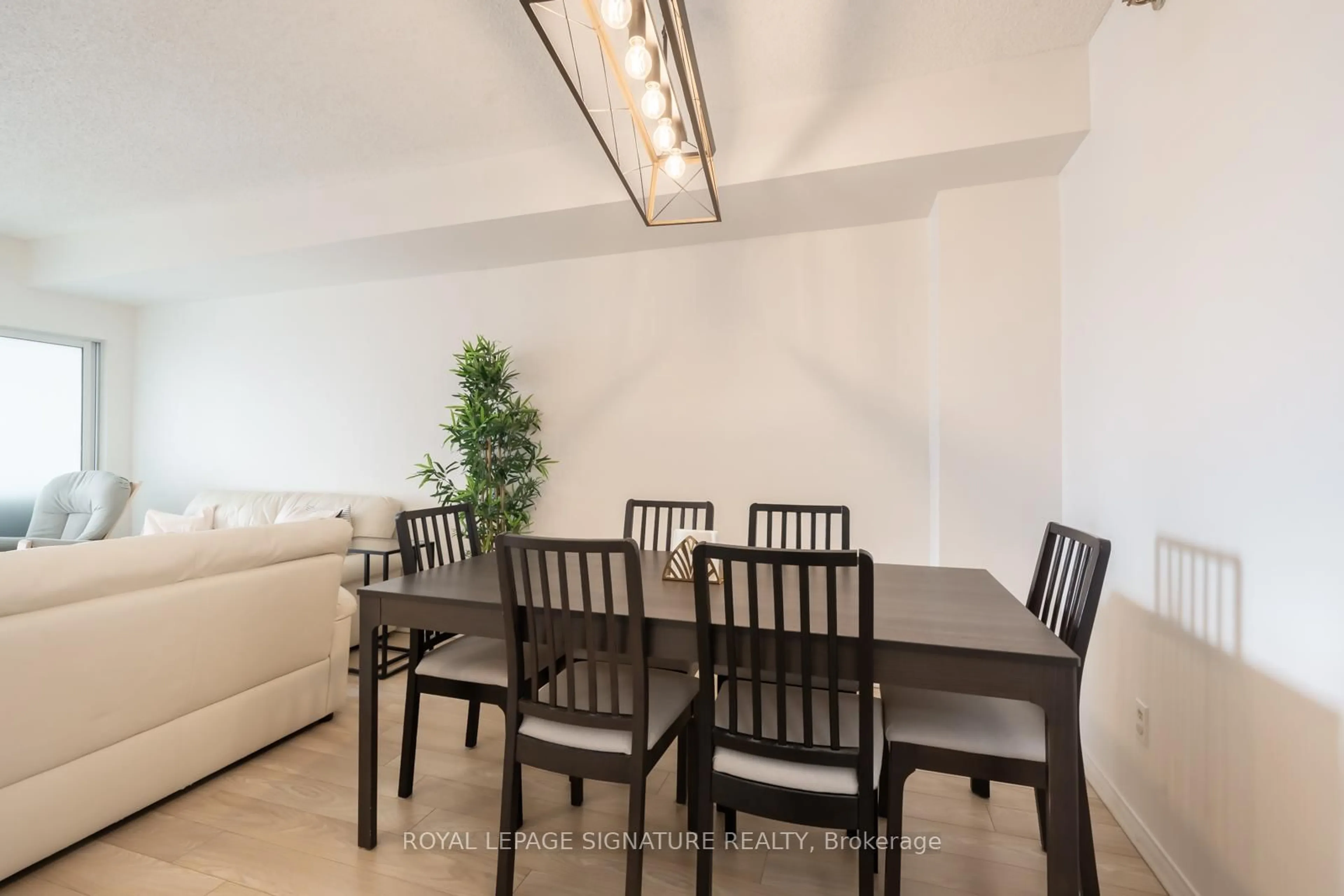 Dining room, wood/laminate floor for 5800 Sheppard Ave #316, Toronto Ontario M1B 5J7
