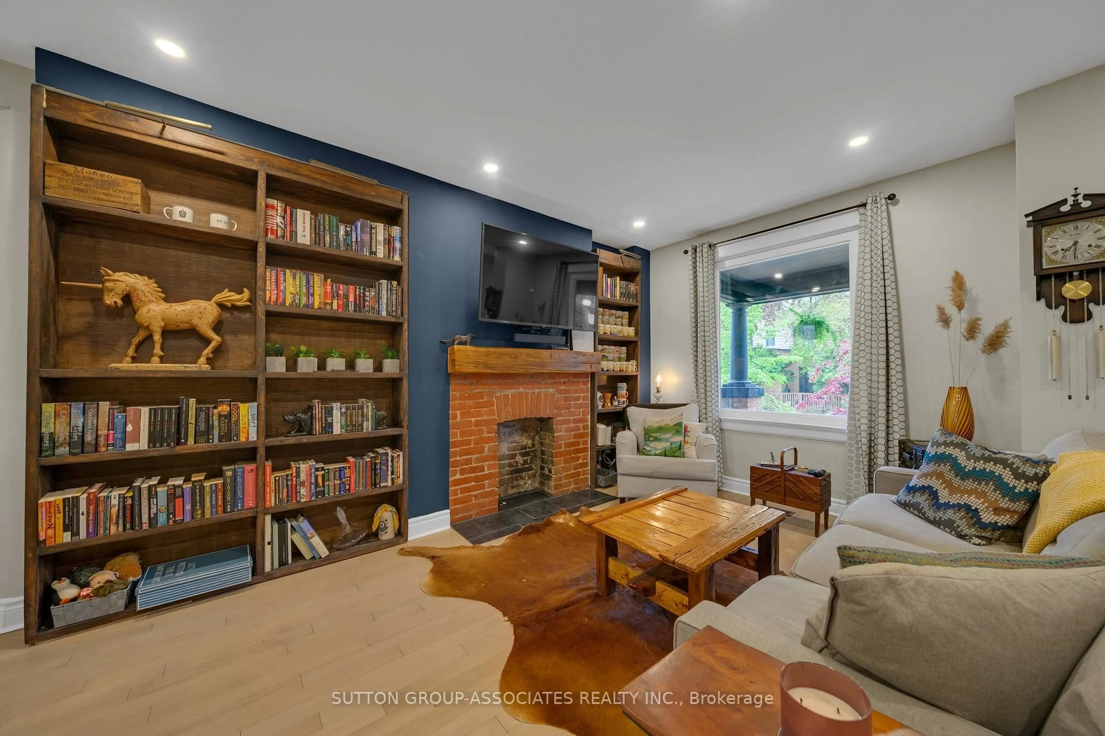 Living room with furniture, wood/laminate floor for 69 Dagmar Ave, Toronto Ontario M4M 1V9
