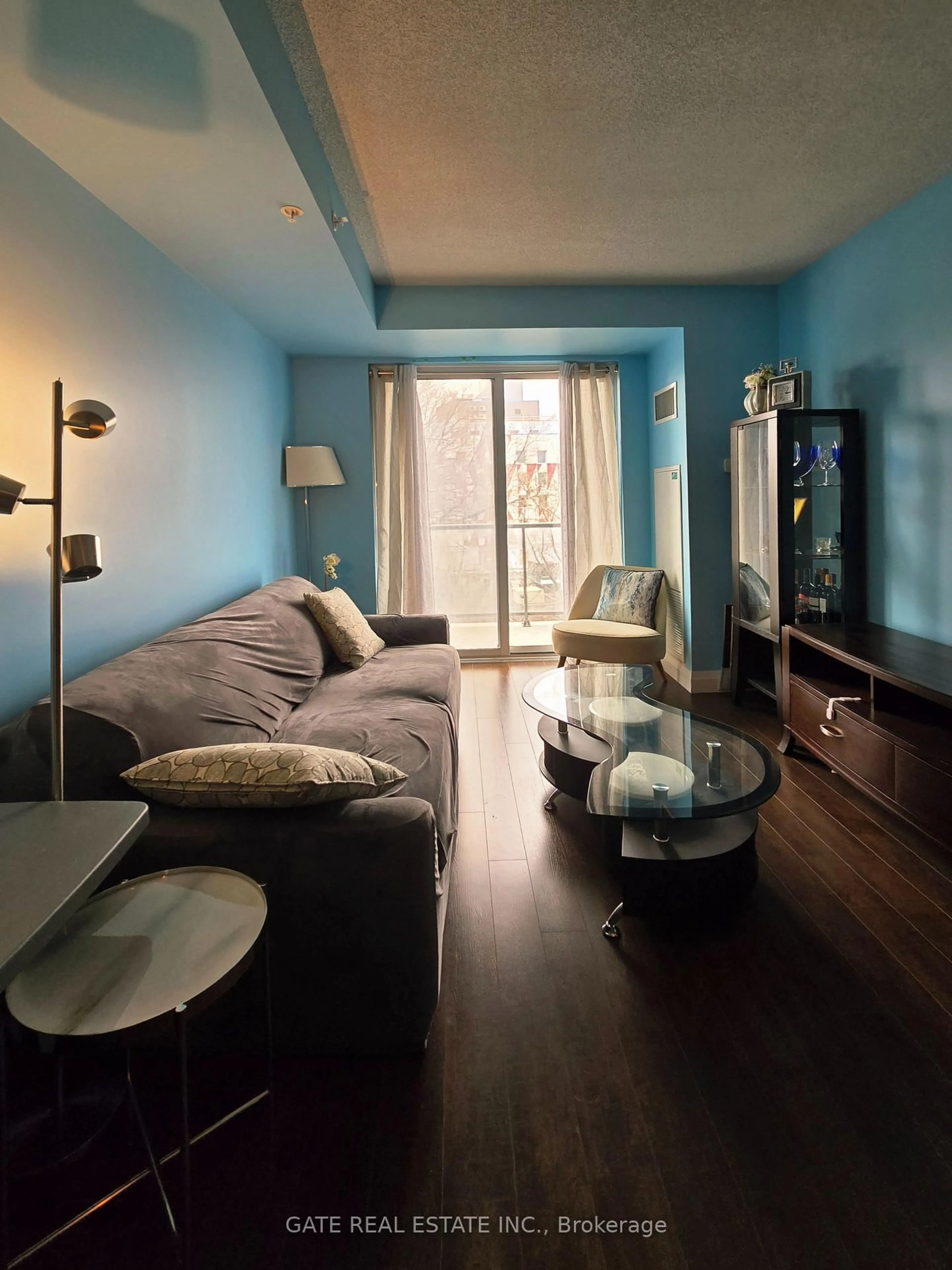 Living room with furniture, wood/laminate floor for 22 East Haven Dr #530, Toronto Ontario M1N 0B4