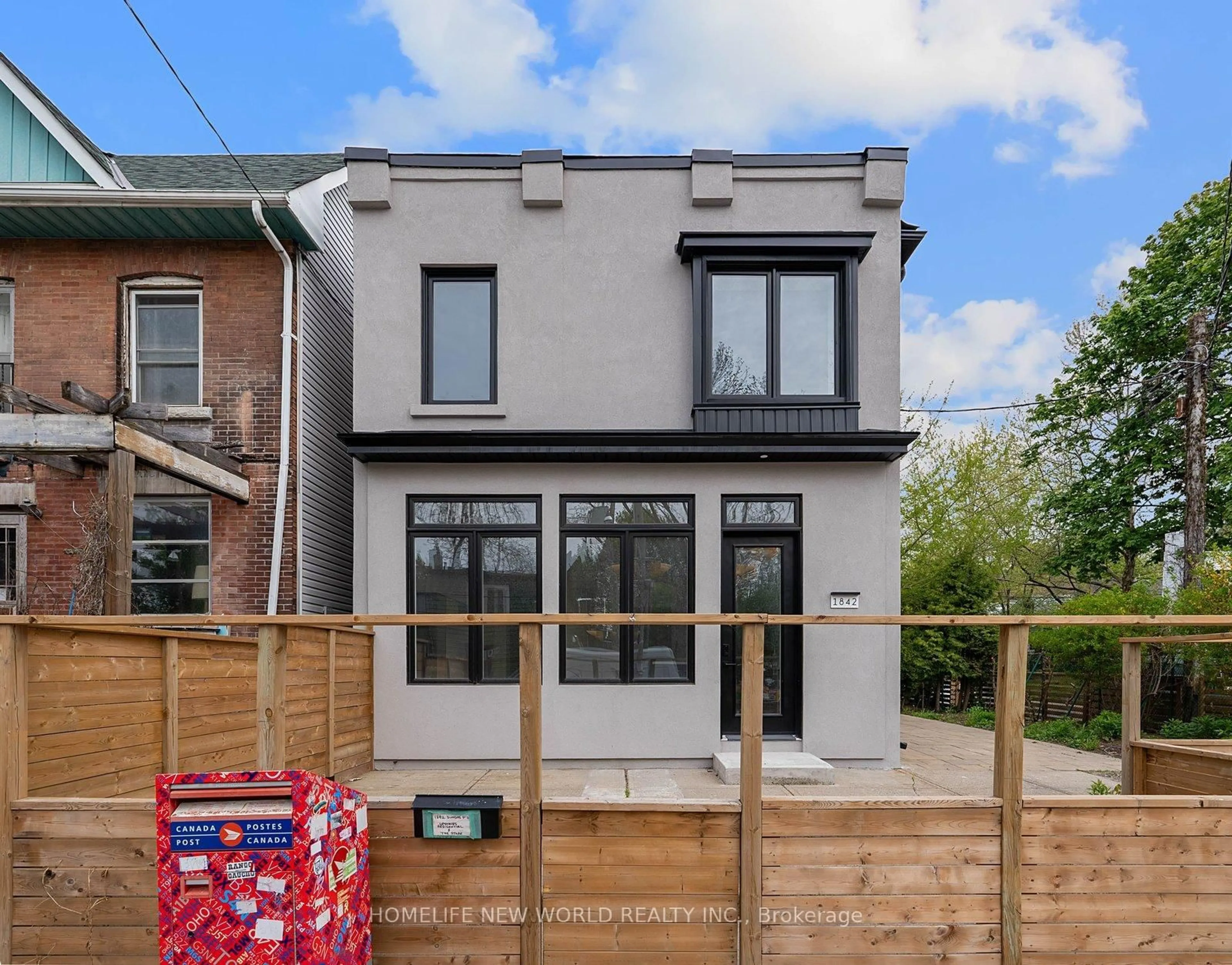 Home with brick exterior material, street for 1842 Dundas St, Toronto Ontario M4L 1M5