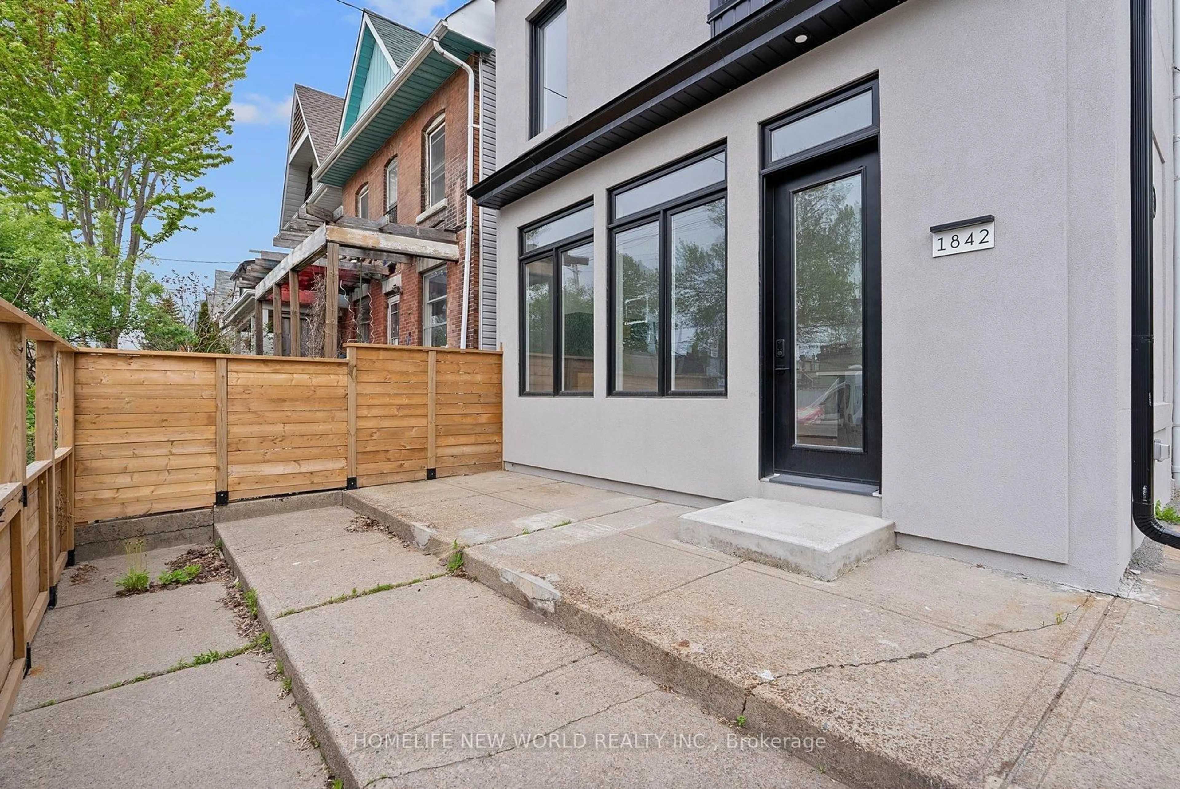 Home with brick exterior material, street for 1842 Dundas St, Toronto Ontario M4L 1M5