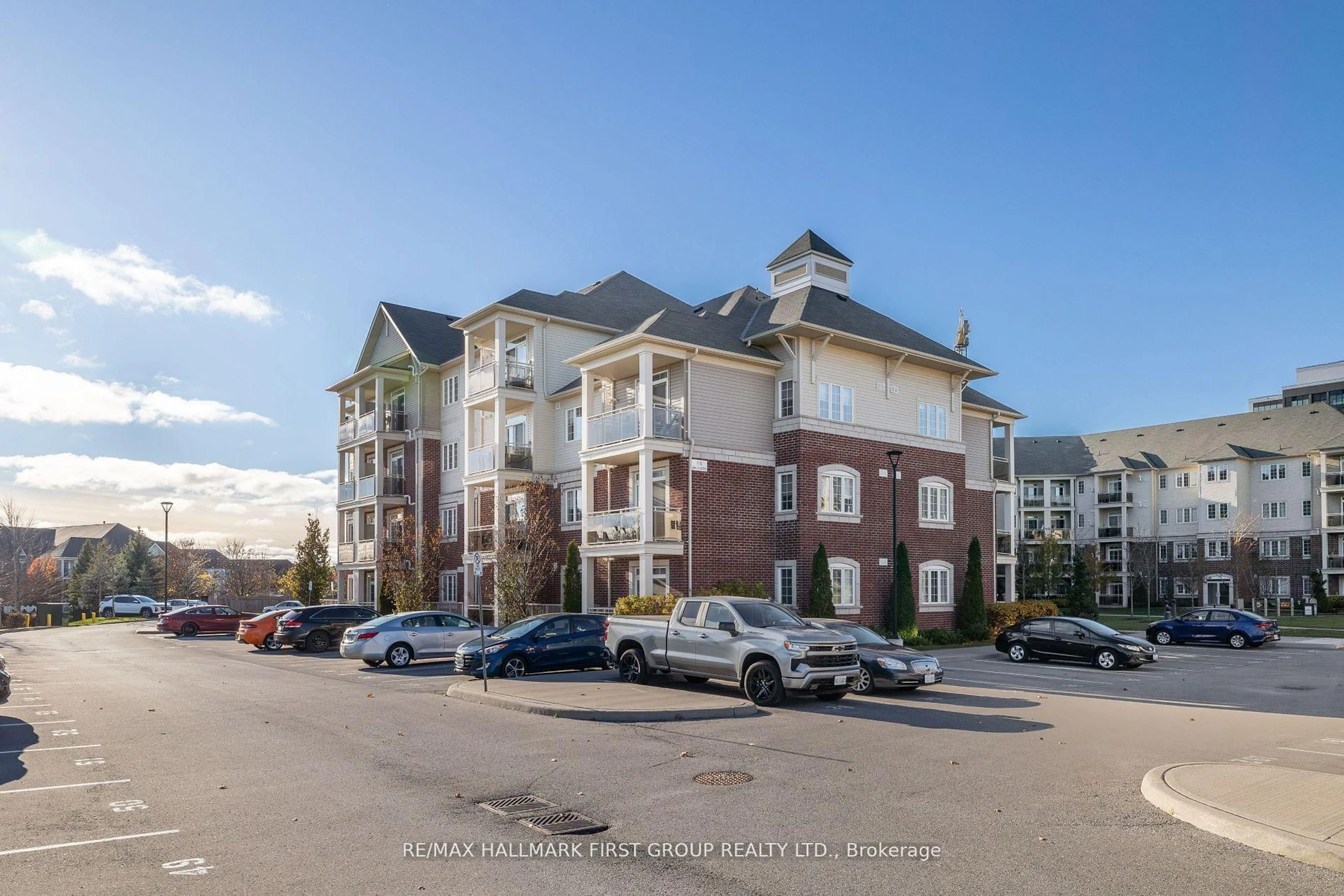 A pic from outside/outdoor area/front of a property/back of a property/a pic from drone, unknown for 84 Aspen Springs Dr #201, Clarington Ontario L1C 0V3