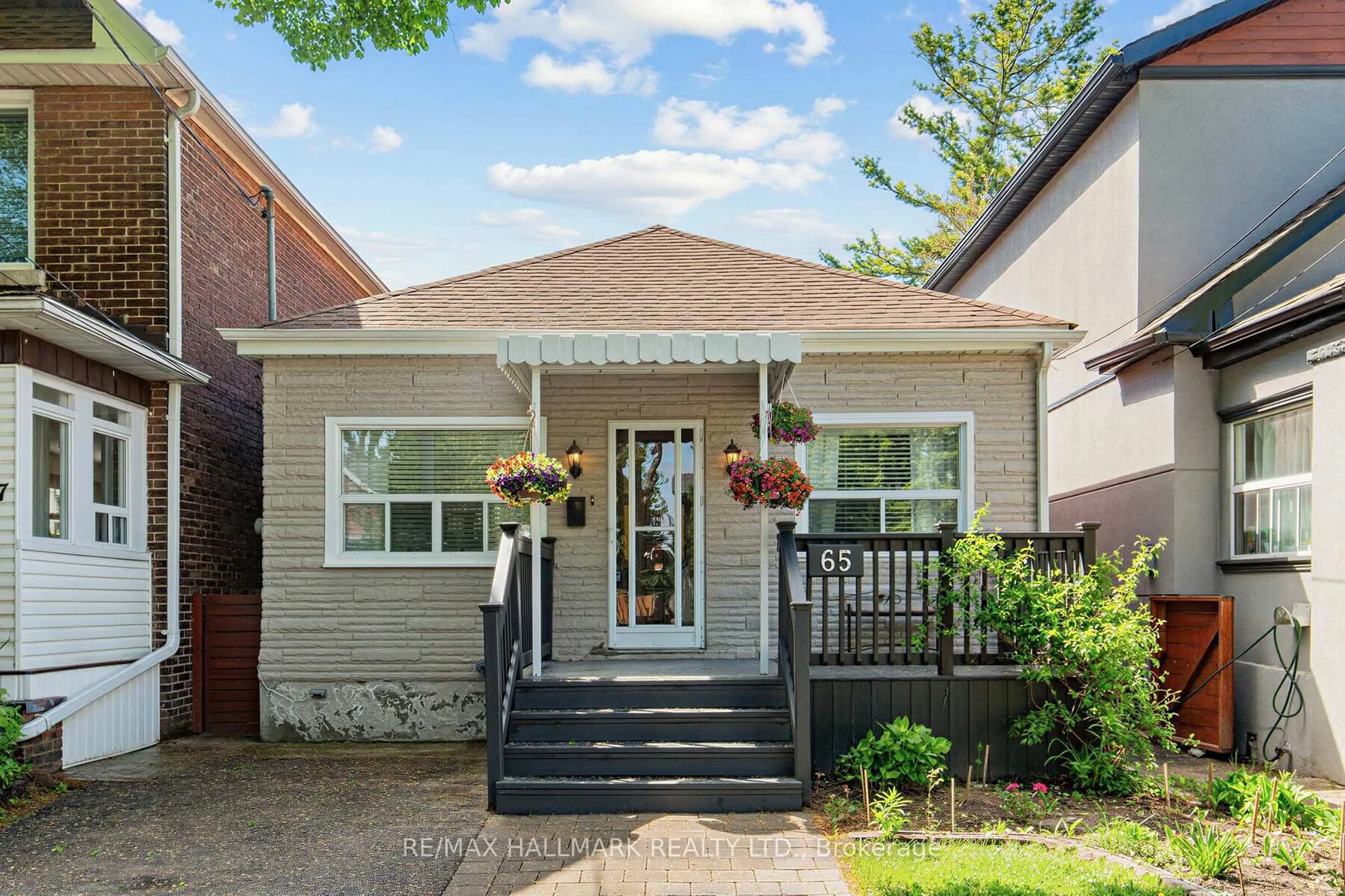 Home with brick exterior material, street for 65 Wallington Ave, Toronto Ontario M4C 2N2