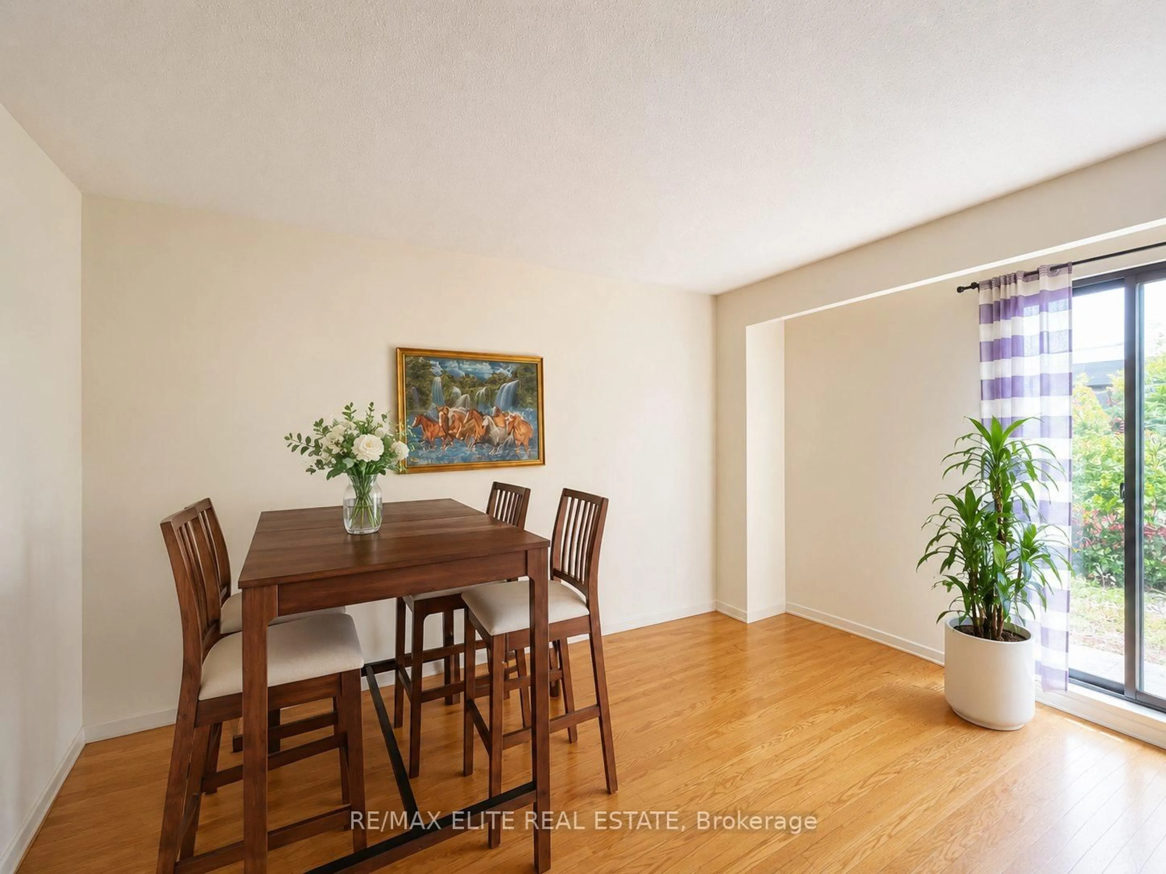 Dining room, wood/laminate floor for 110 Purpledusk Tr, Toronto Ontario M1E 4E1