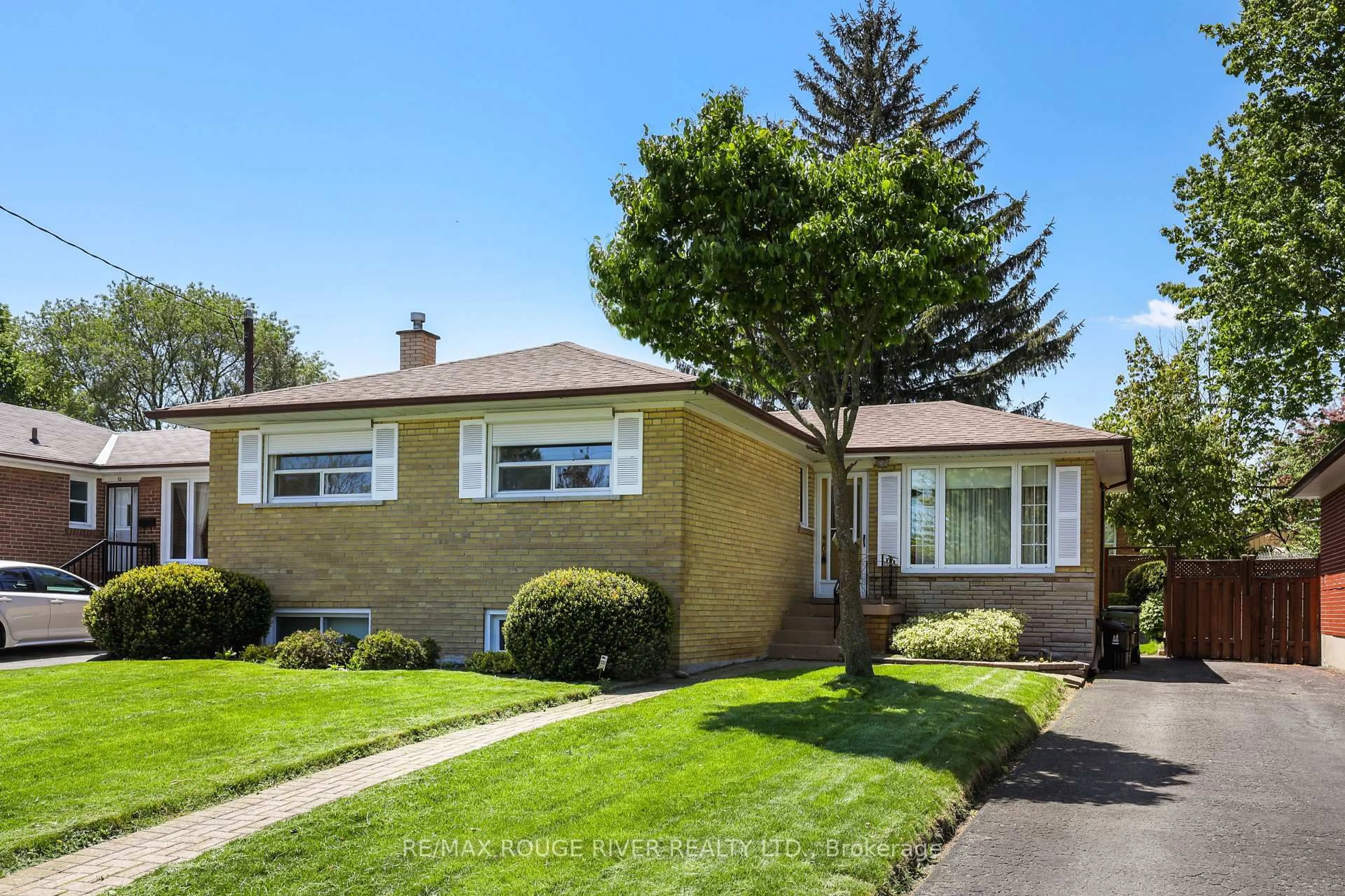 Home with brick exterior material, street for 14 Farmbrook Rd, Toronto Ontario M1J 2S4