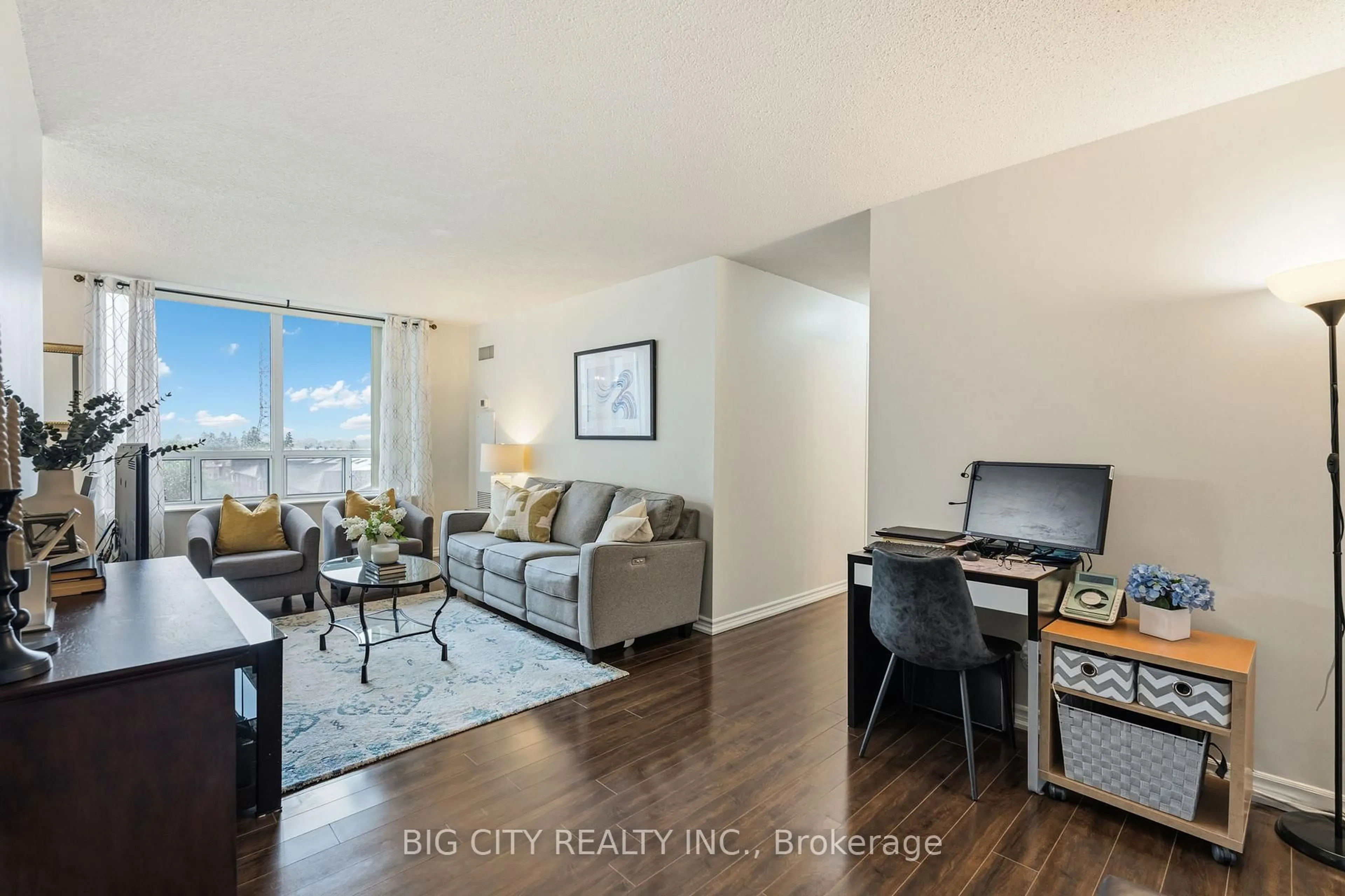 Living room with furniture, wood/laminate floor for 1883 Mcnicoll Ave #703, Toronto Ontario M1V 5M3