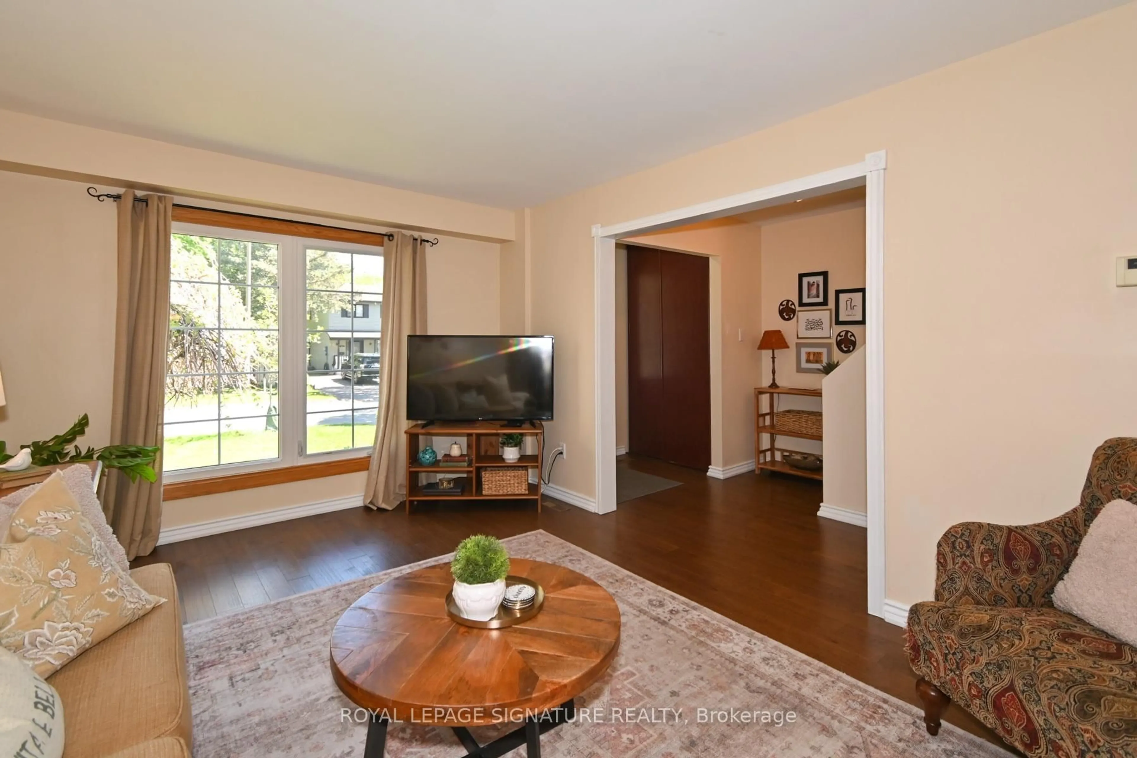 Living room with furniture, wood/laminate floor for 830 Greenbriar Dr, Oshawa Ontario L1G 6G6