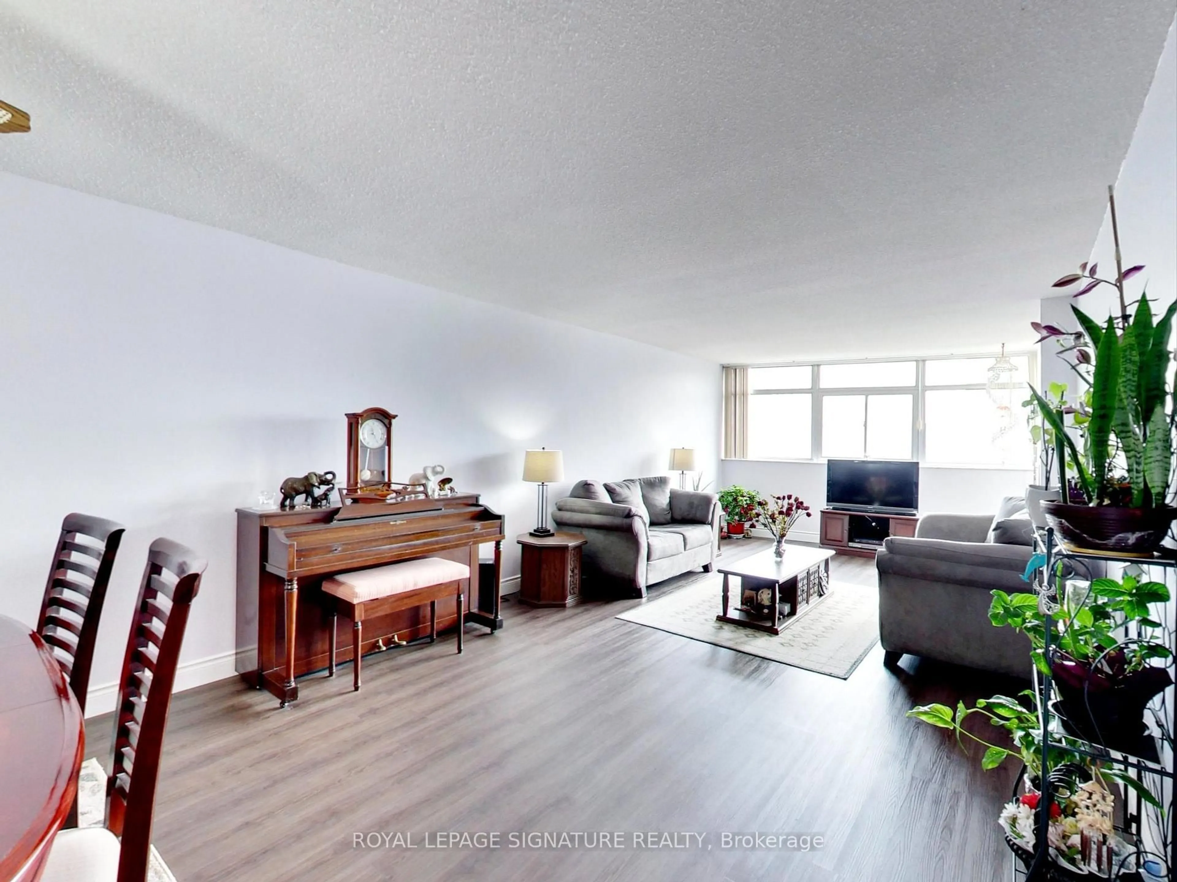 Living room with furniture, unknown for 3151 Bridletowne Circ #506, Toronto Ontario M1W 2T1