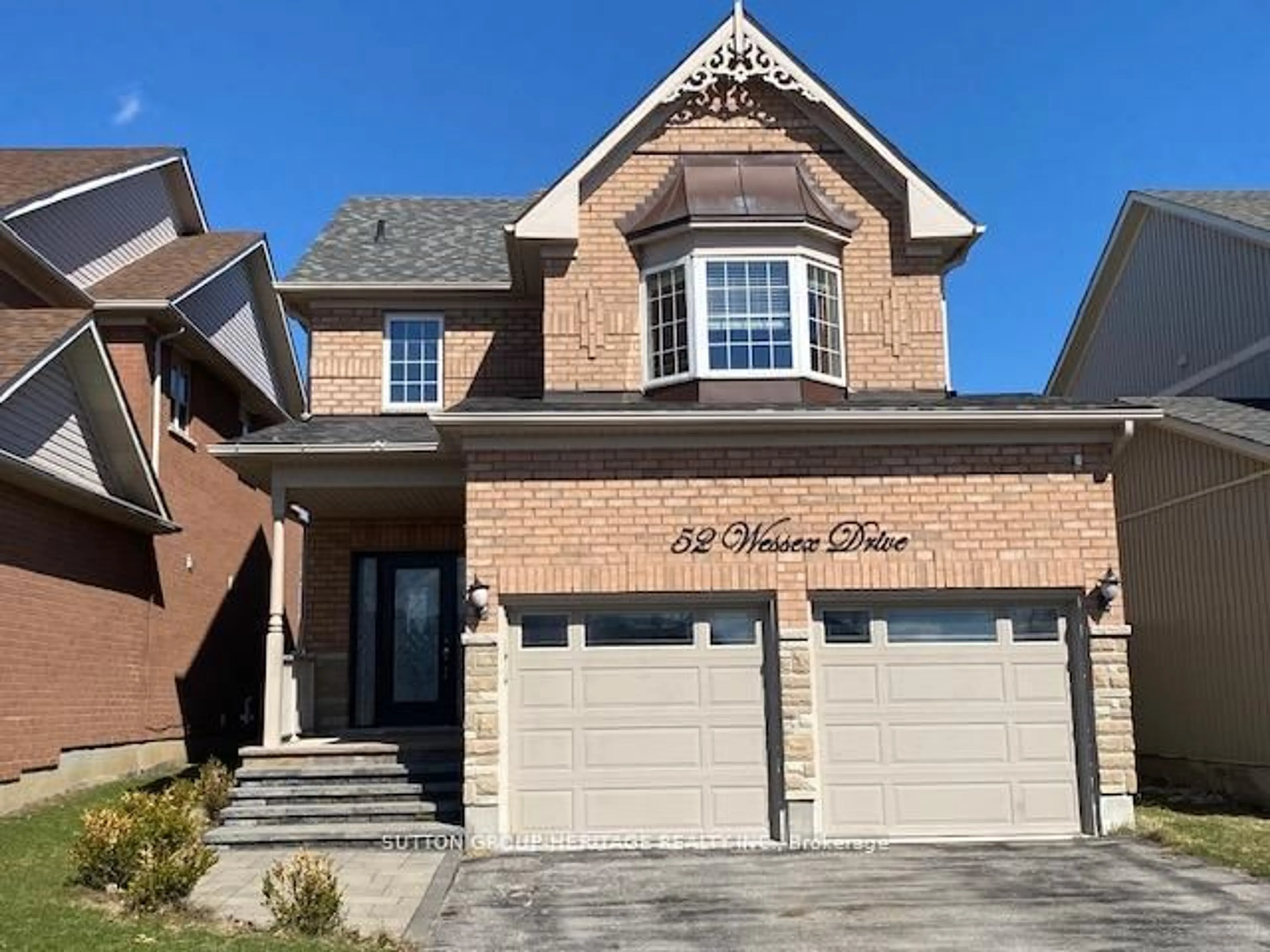 Home with brick exterior material, street for 52 Wessex Dr, Whitby Ontario L1M 2C3